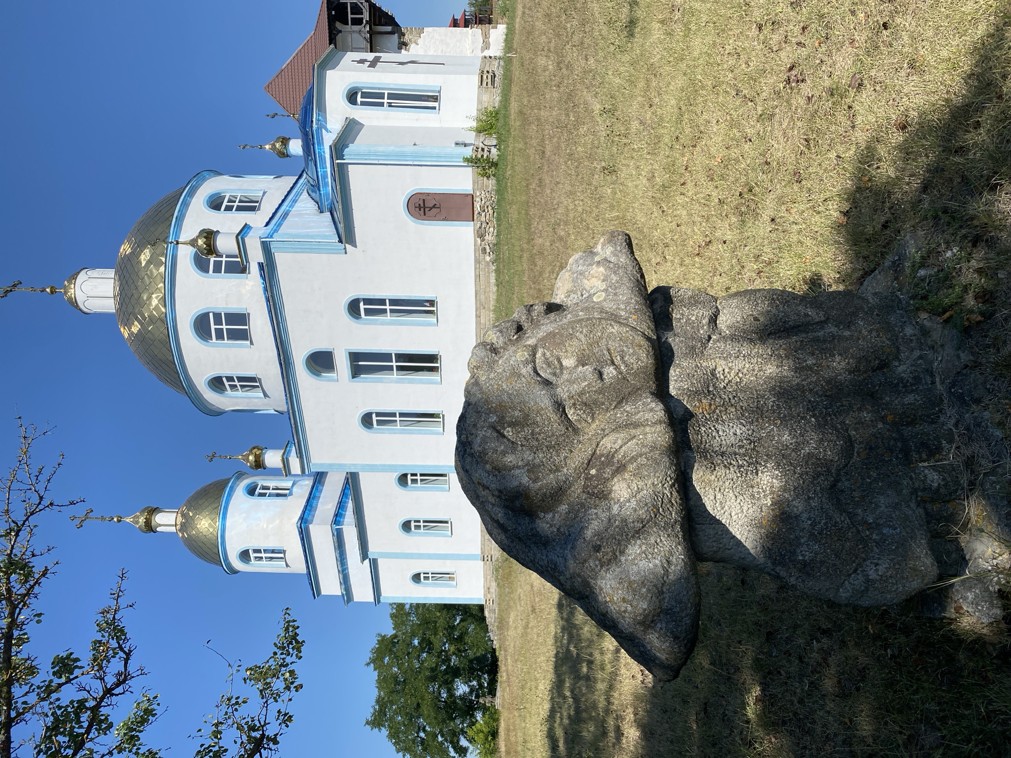 Historic cemetery and stone sculptures in Busha, Ukraine