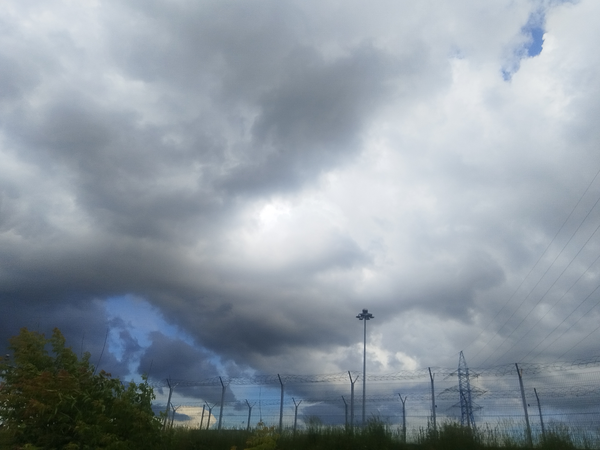 Overcast afternoon across Mytishchi's infrastructure and open skies