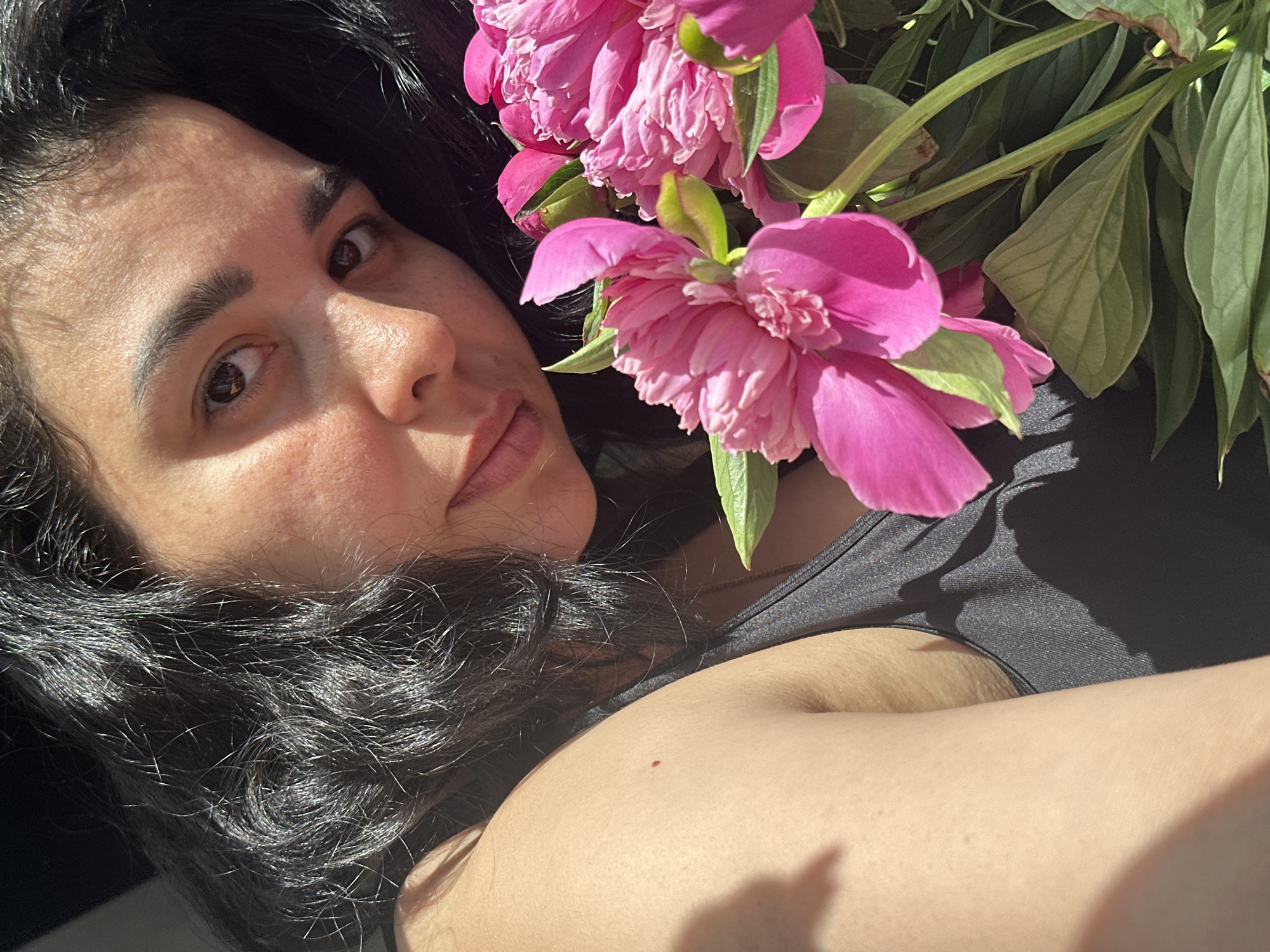Woman and child photographed with pink peonies in brief session