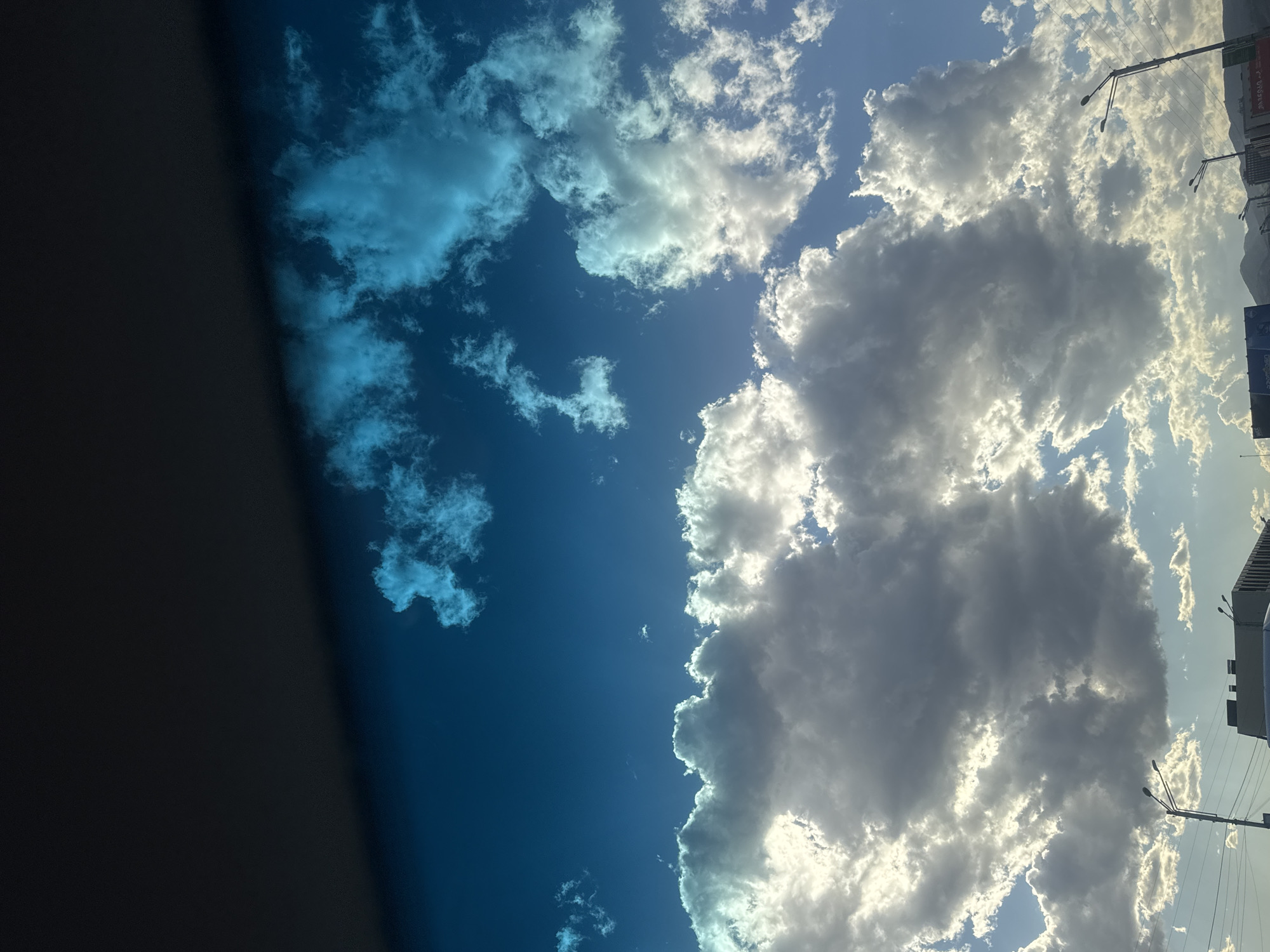 Woman documents car journey through Tbilisi on sunny afternoon