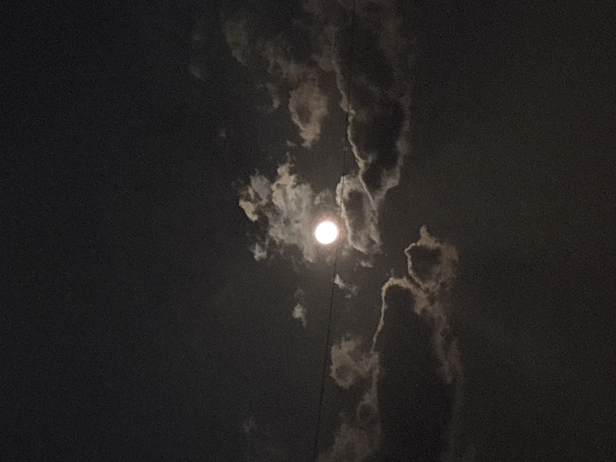Full moon observed through clouds in Hrodna, Belarus