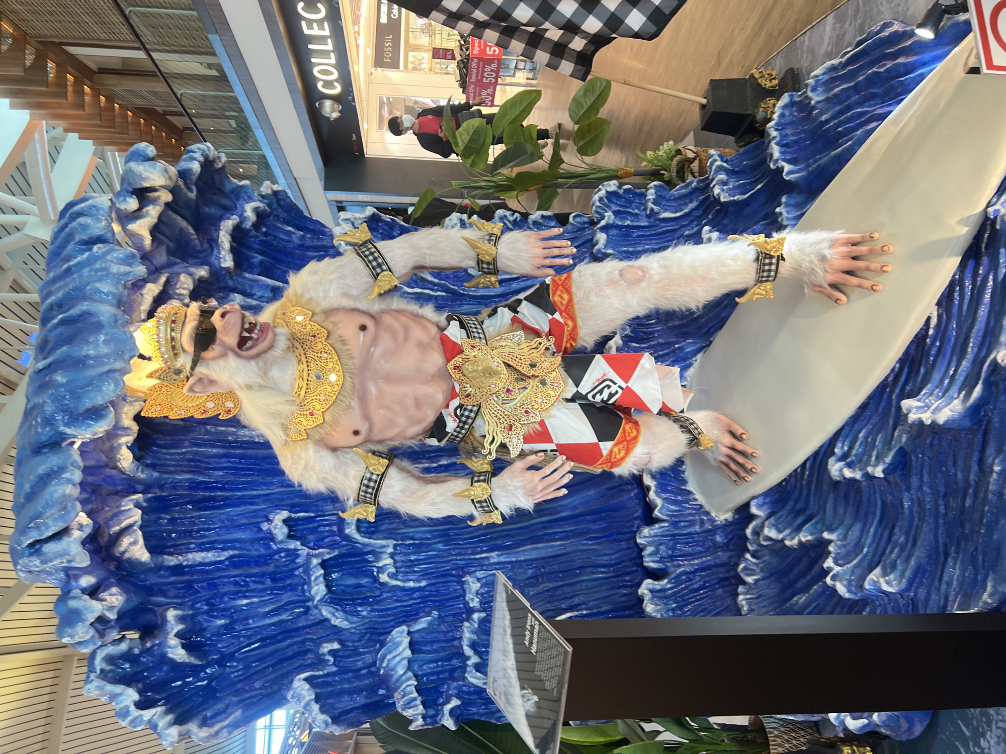 Bali airport departure zone: monkey mascots and terminal scenes