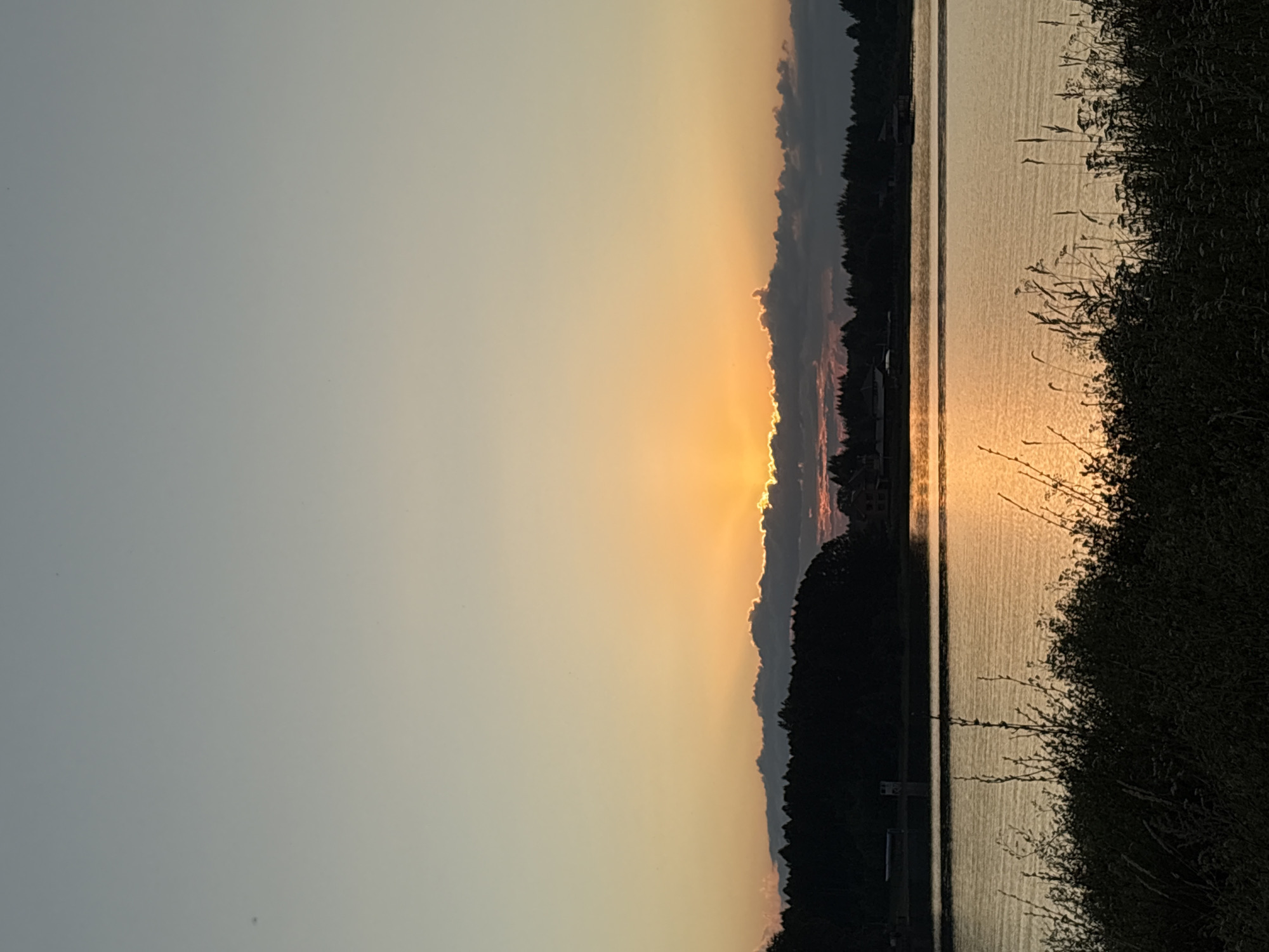 Warm sunset over a river or lake near Elovo, Russia