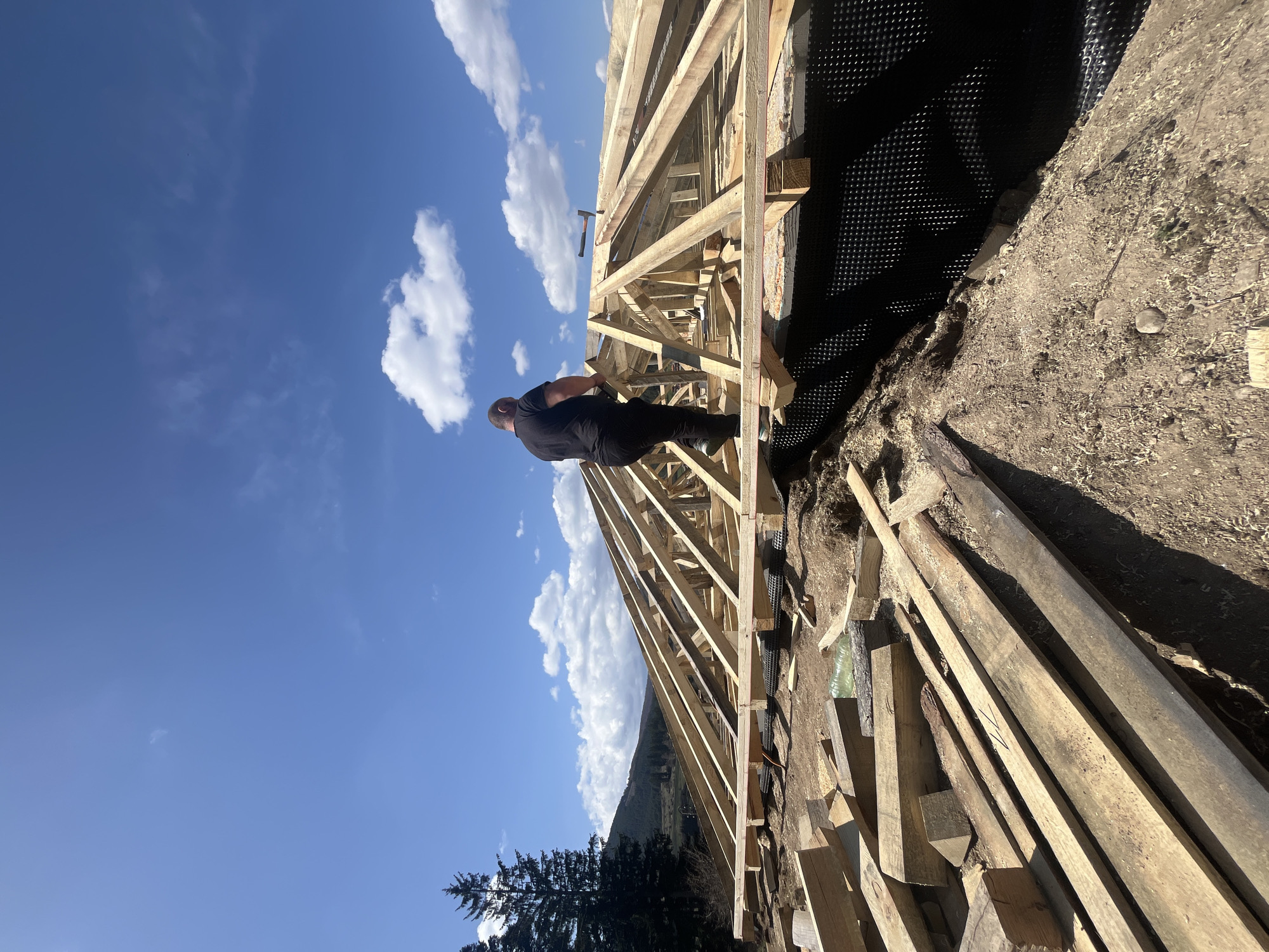 Construction worker observed at outdoor site in Koprivshtitsa, Bulgaria