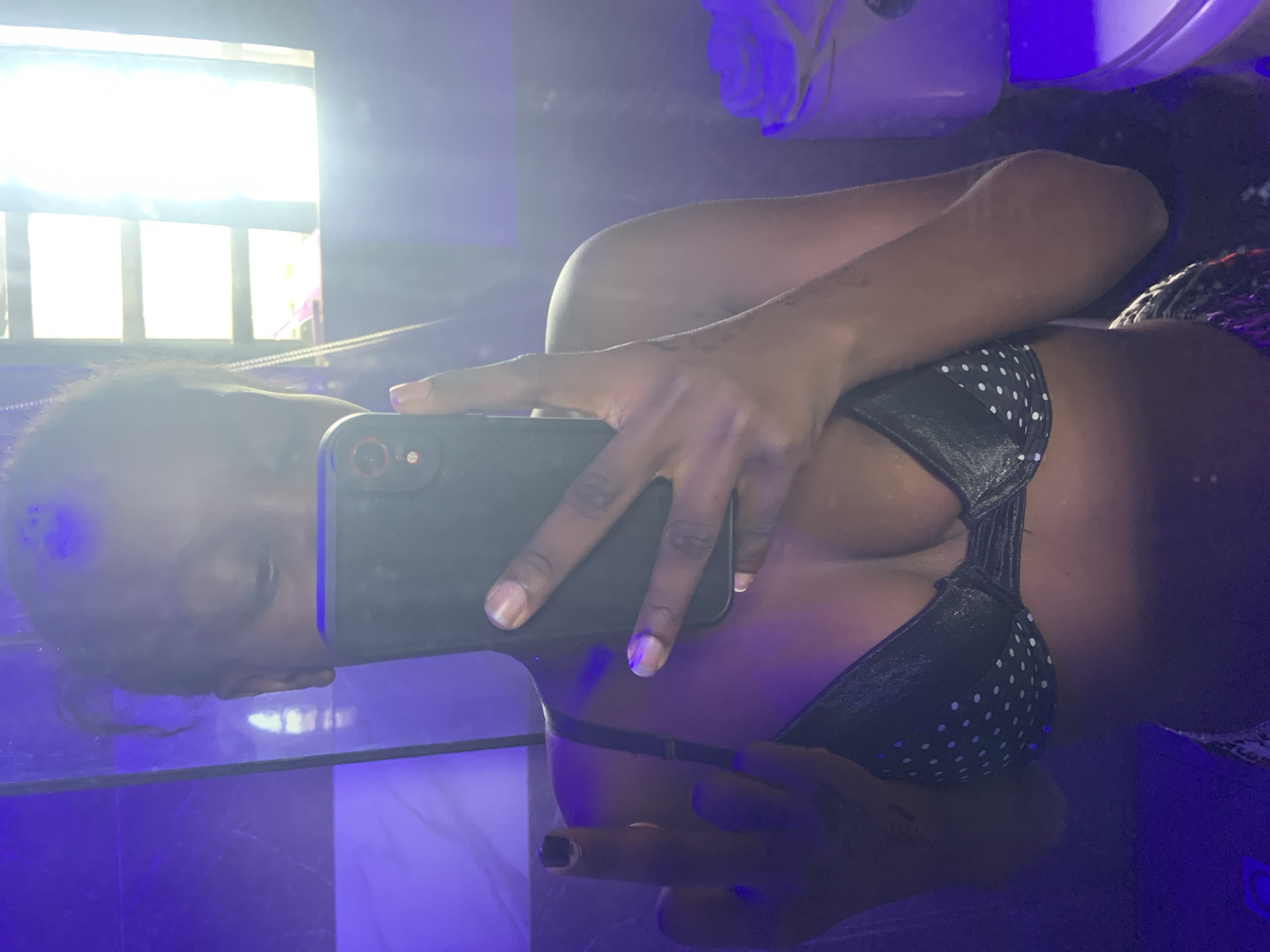 Person takes multiple mirror selfies in Ota, Nigeria home