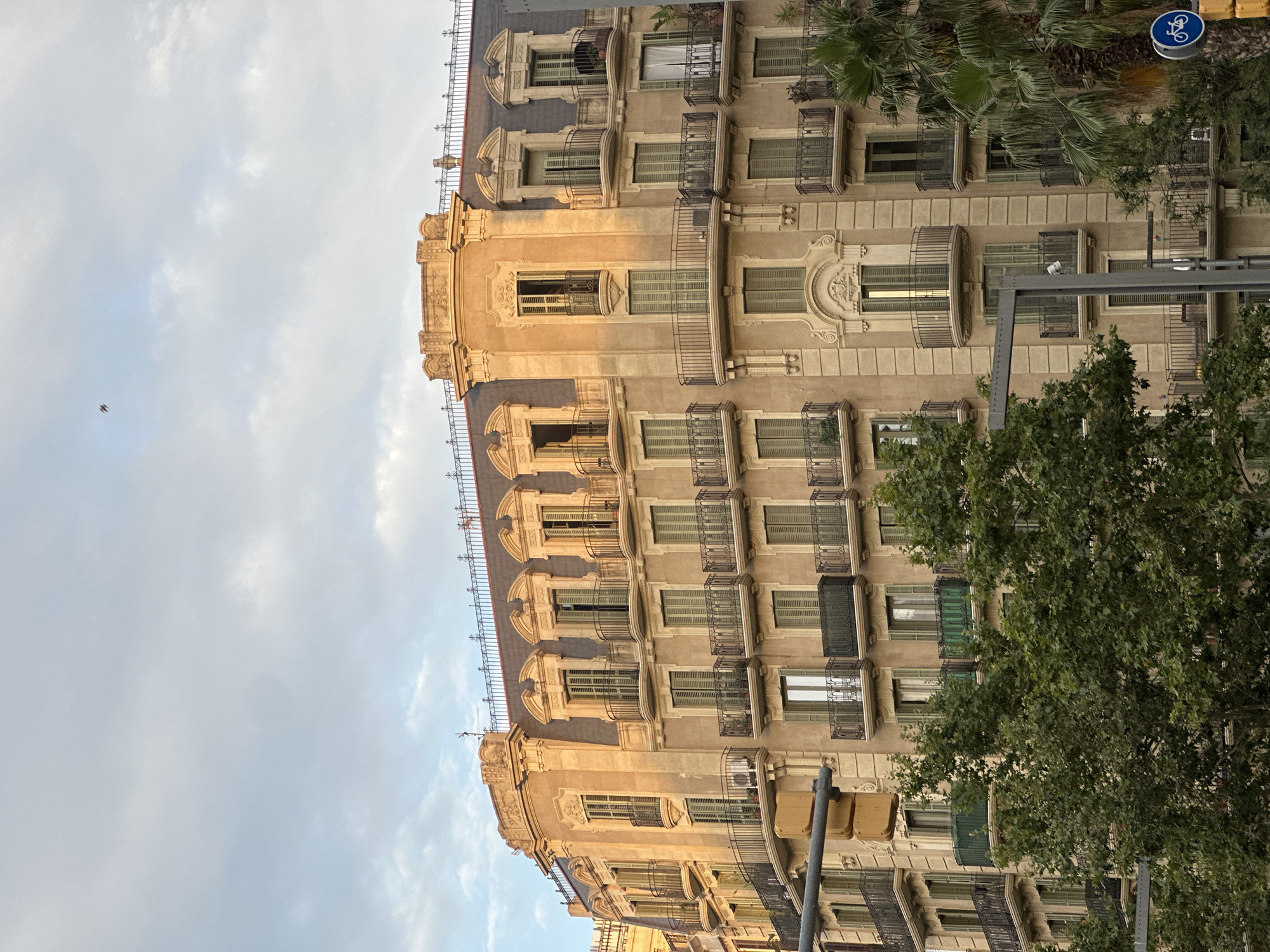 Street-level Barcelona: Eixample facades, shuttered shops, and urban detail