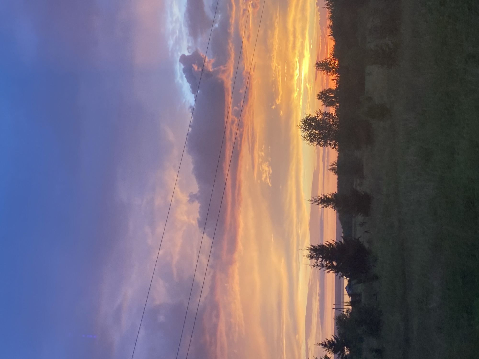 Vivid summer sunset over rural Kryukovo, Russia