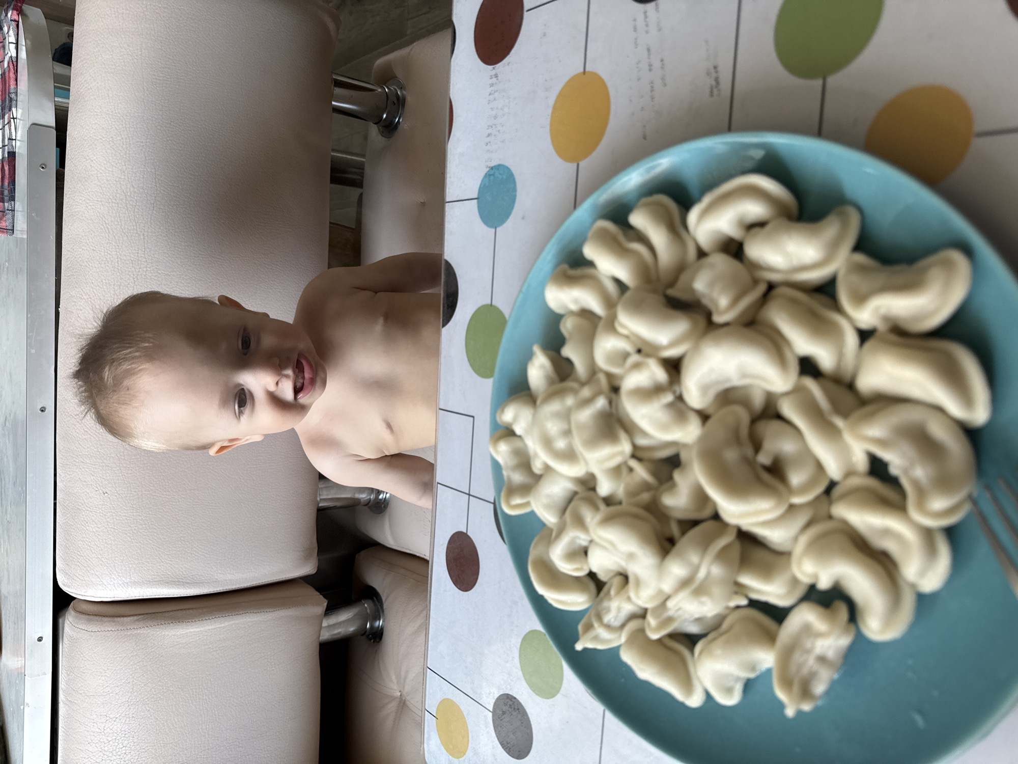 Child enjoys traditional pelmeni meal in Chaikovsky, Russia