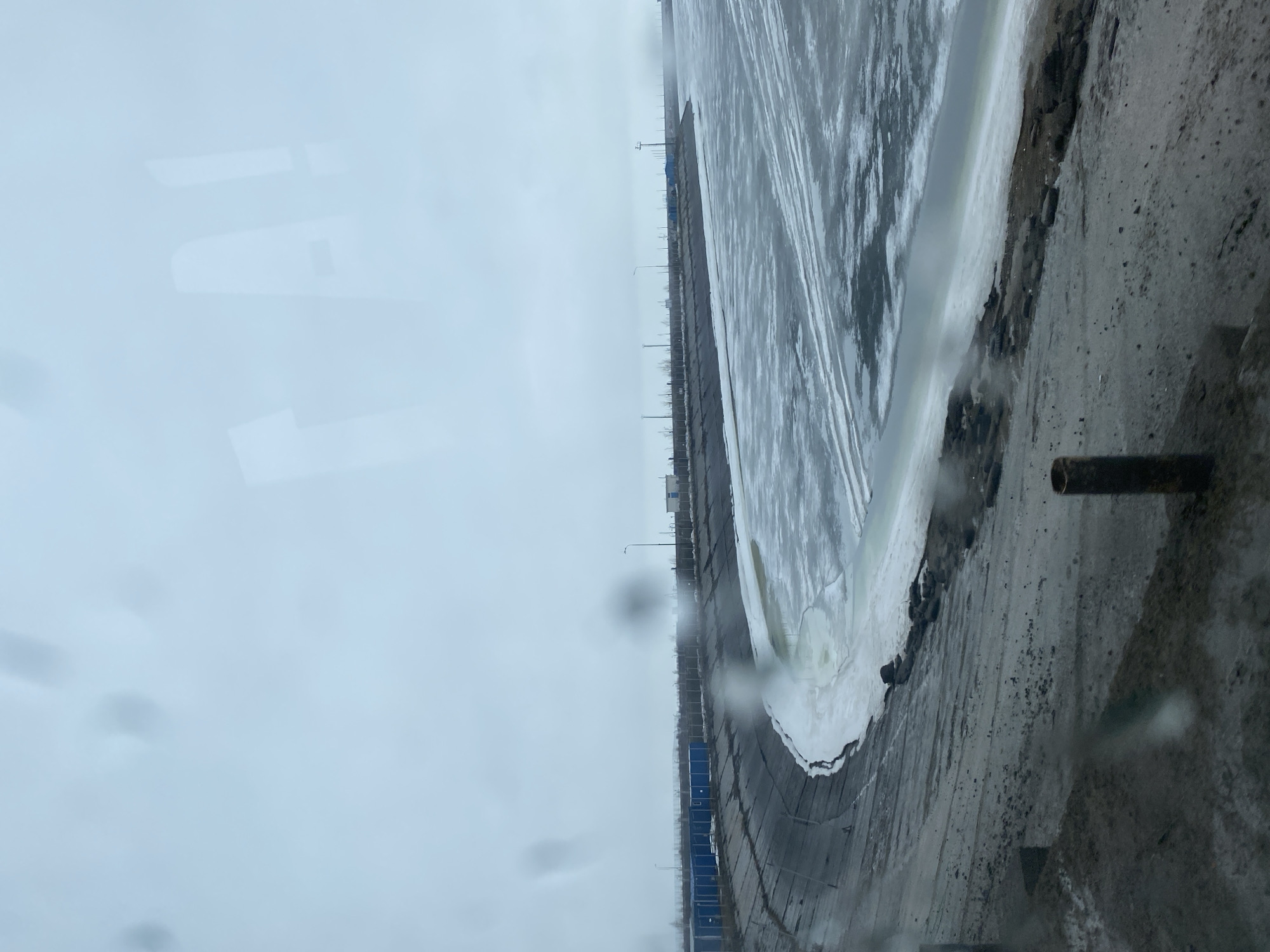 Ice-covered water observed near buildings in Chaikovsky, Russia