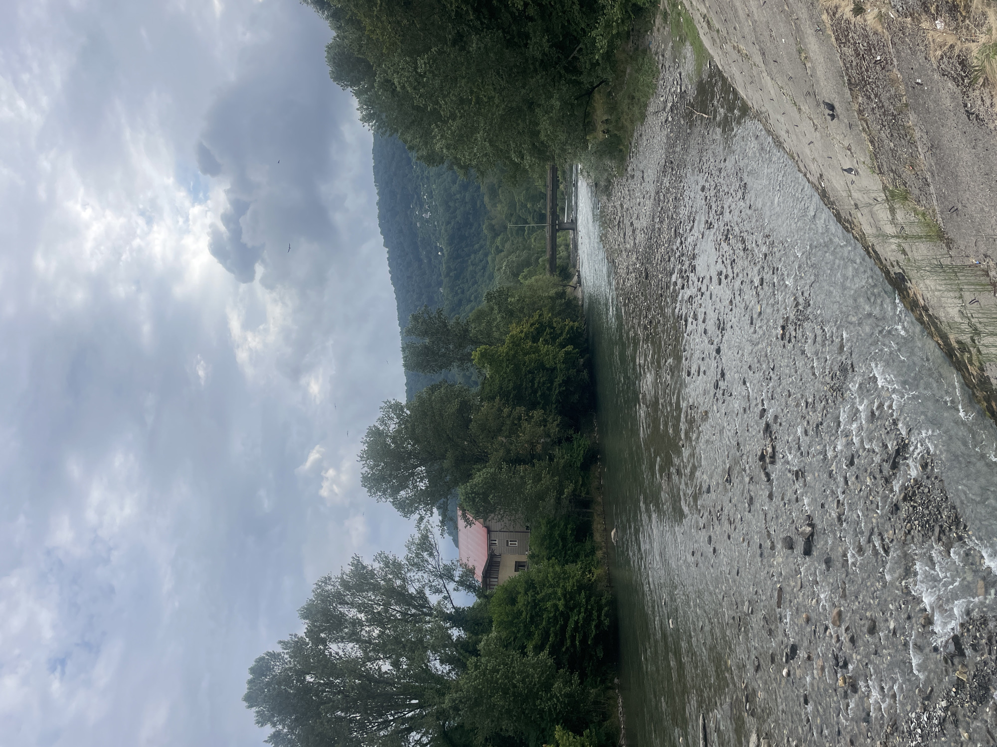 Cloudy morning stroll along a rocky riverside park in Sochi