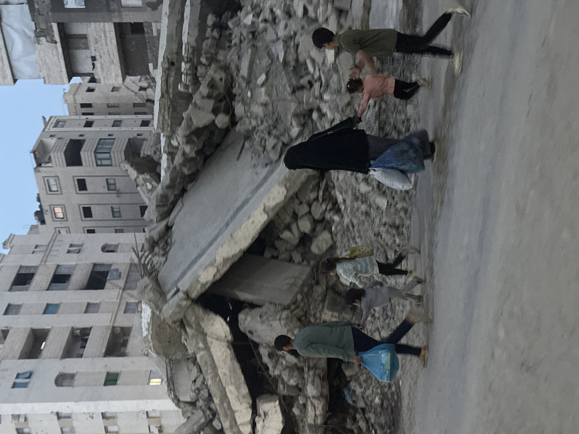 Gaza residents conduct daily commerce amid damaged cityscape