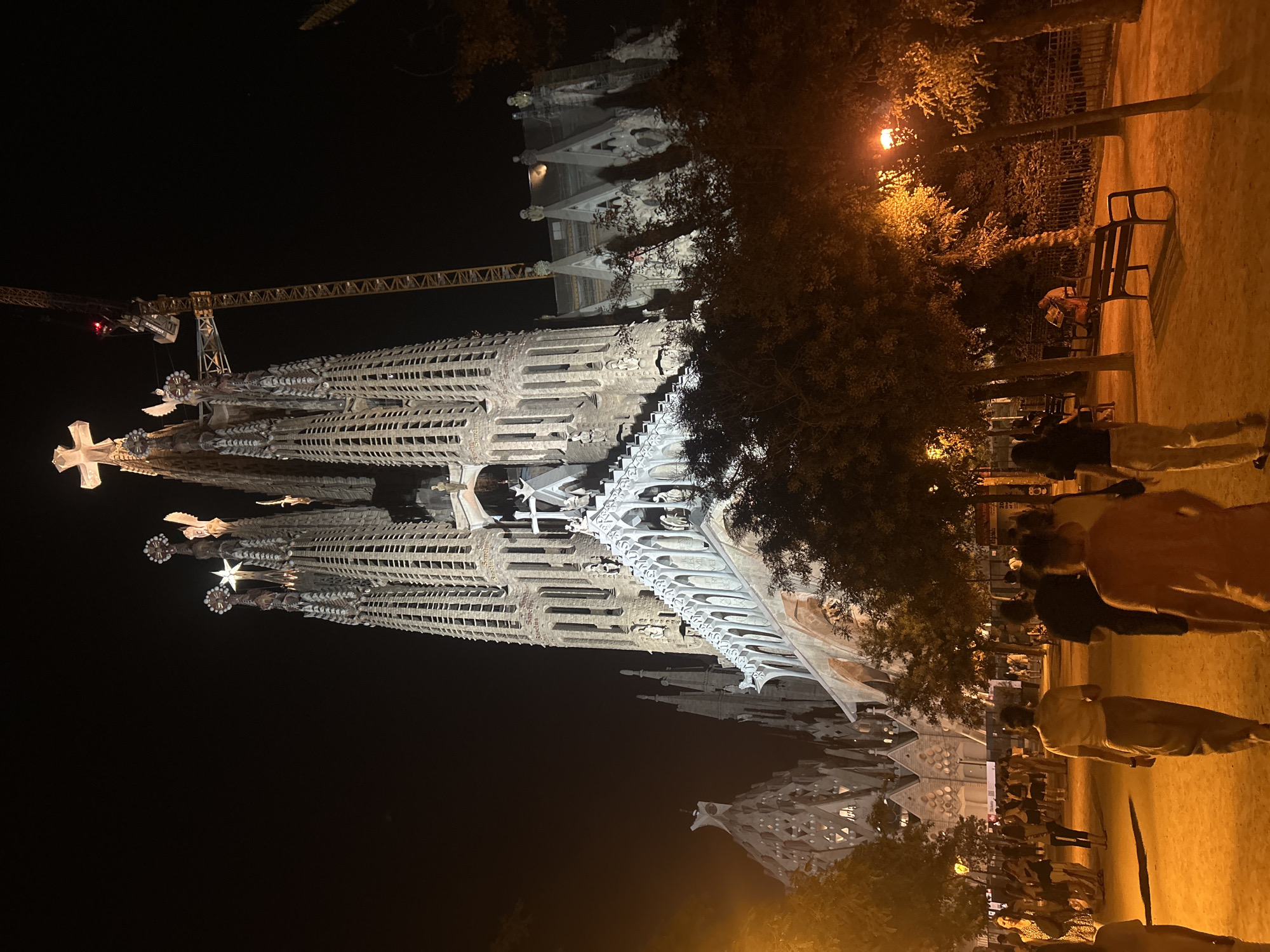 Barcelona at night: Sagrada Família and a glowing city arch