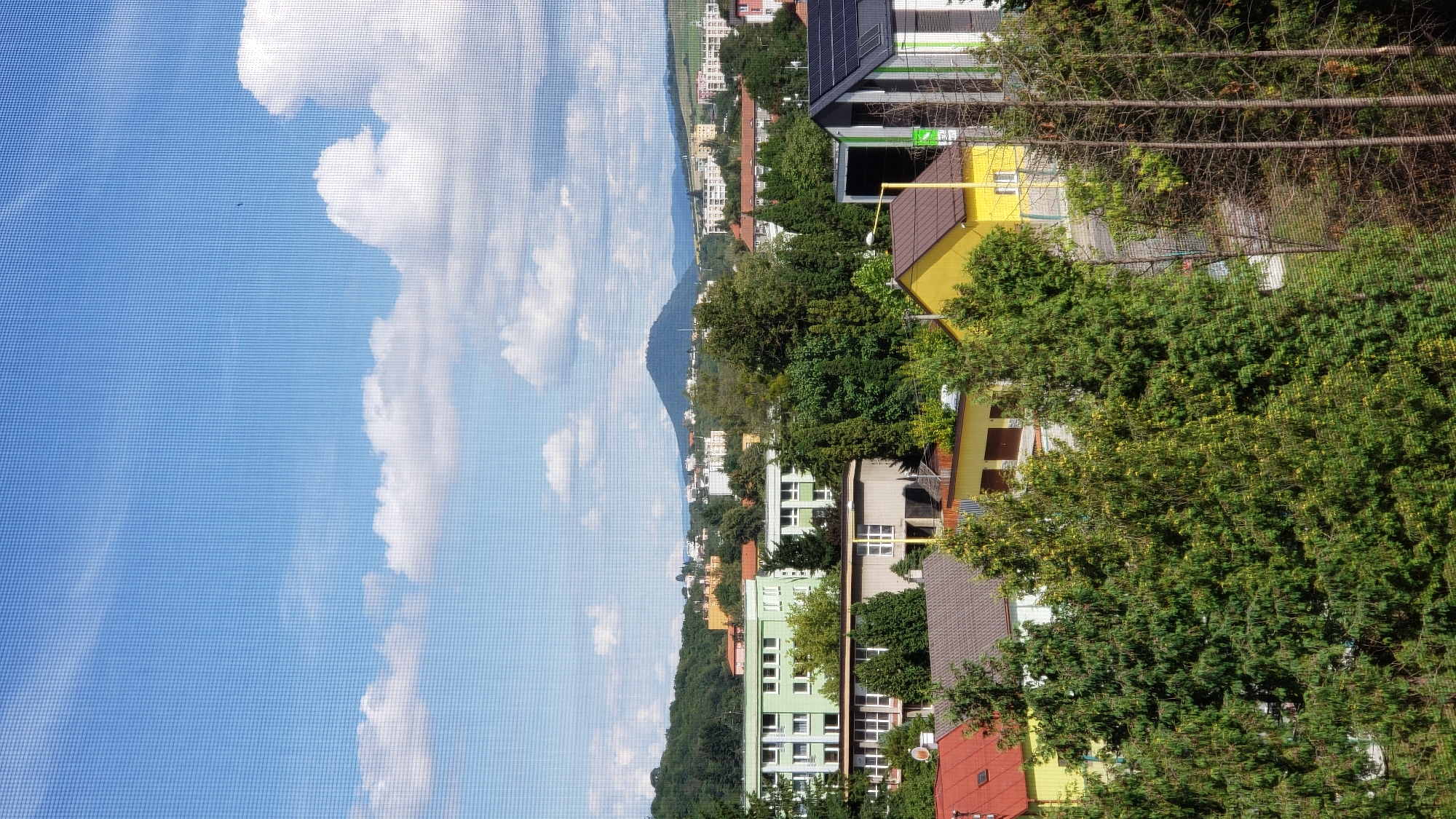 Morning across Prešov: rooftops, streets, and green hillsides