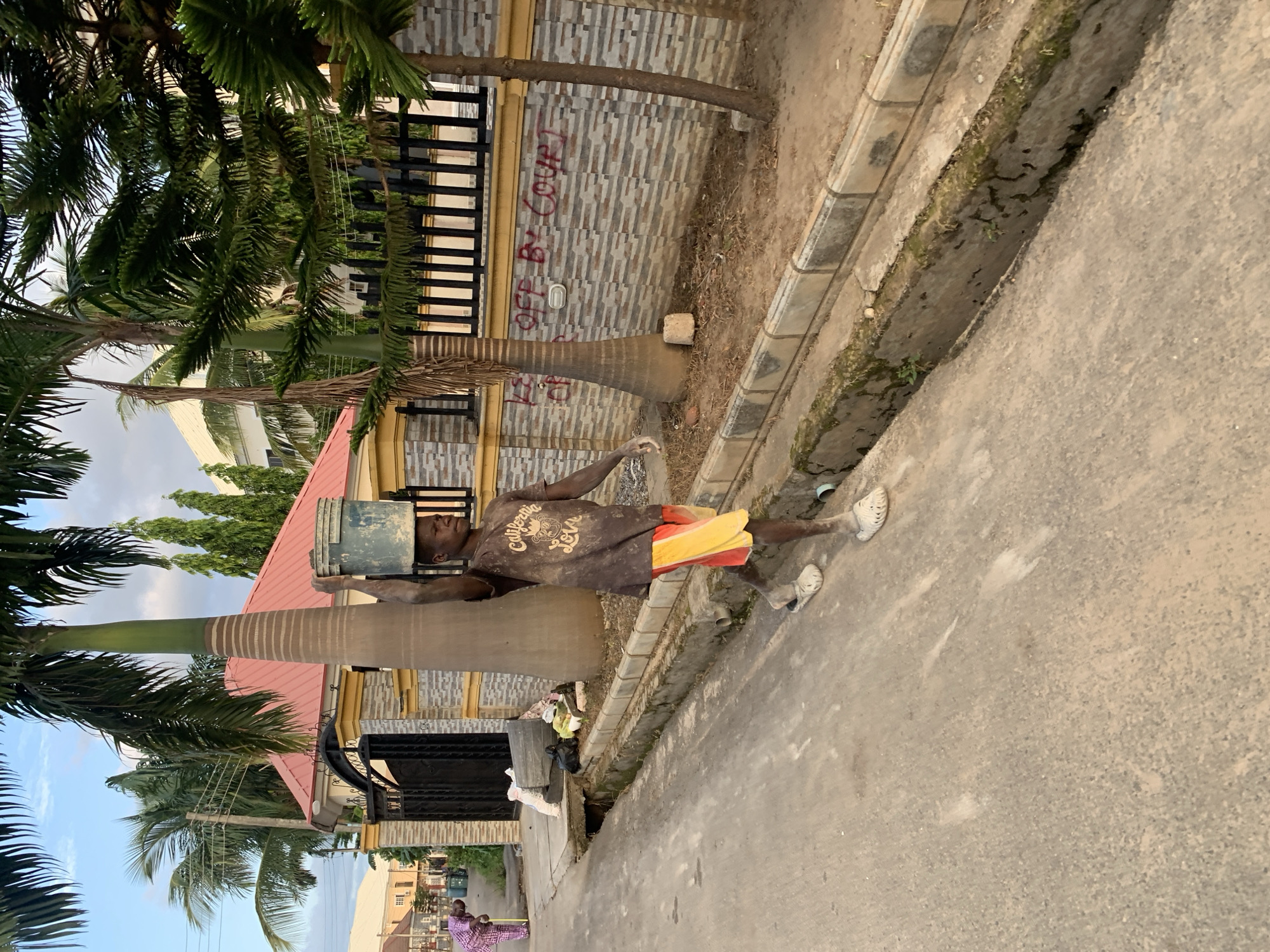 Afternoon street life captured across Abuja residential neighborhoods
