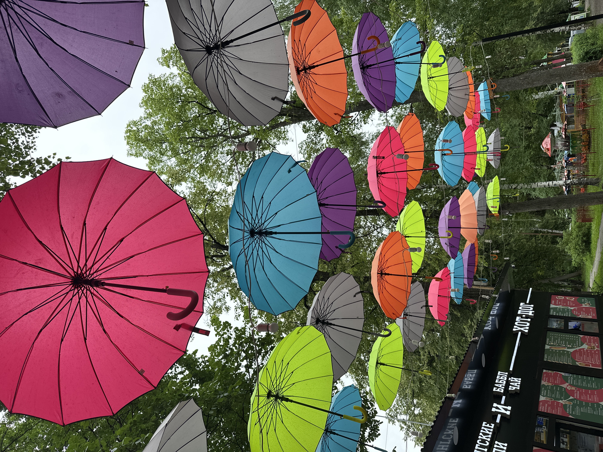Morning at Cosmonauts Park, Izhevsk — rides, Matryoshkas, umbrella canopy