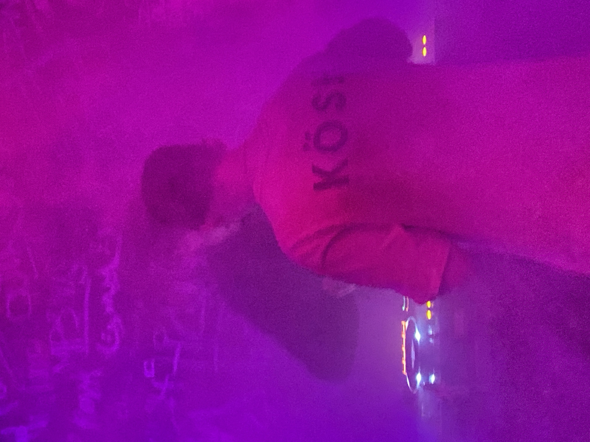 DJ performs at nightclub in Шебунино, Russia amid colorful lighting