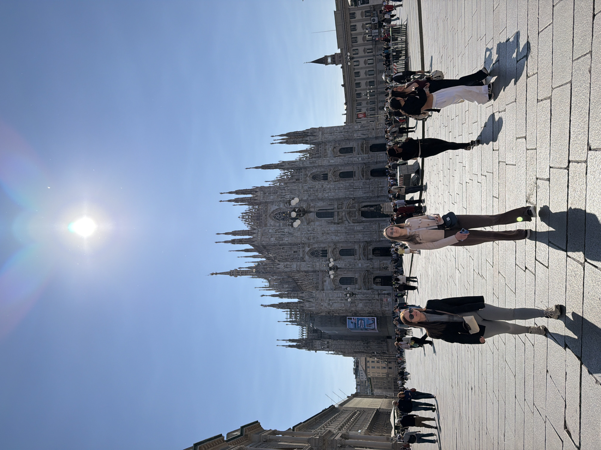 Morning crowds gather at Milan's Duomo on sunny May Day