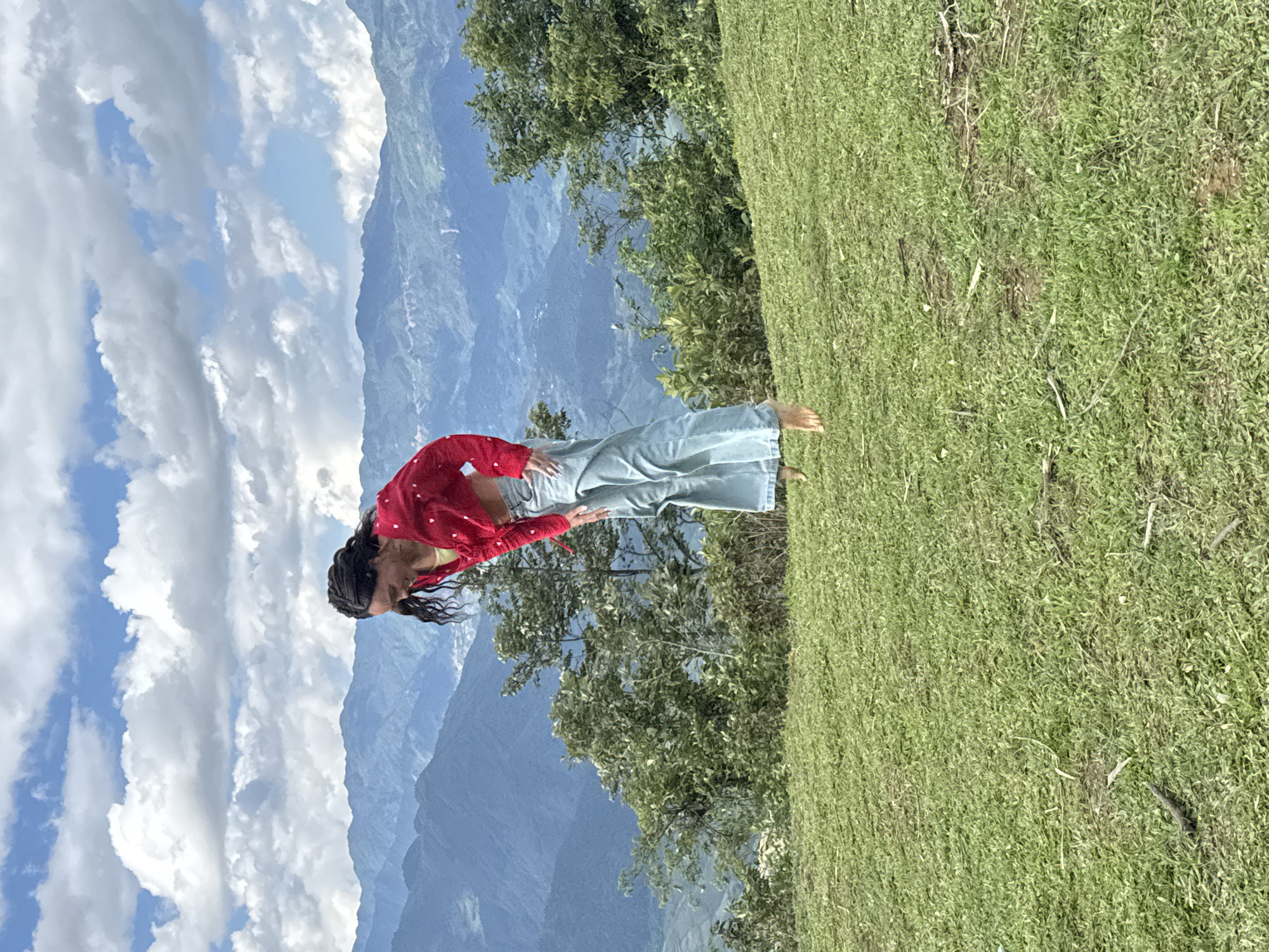 Tourists jump and pose on Tu Le hilltop during morning visit