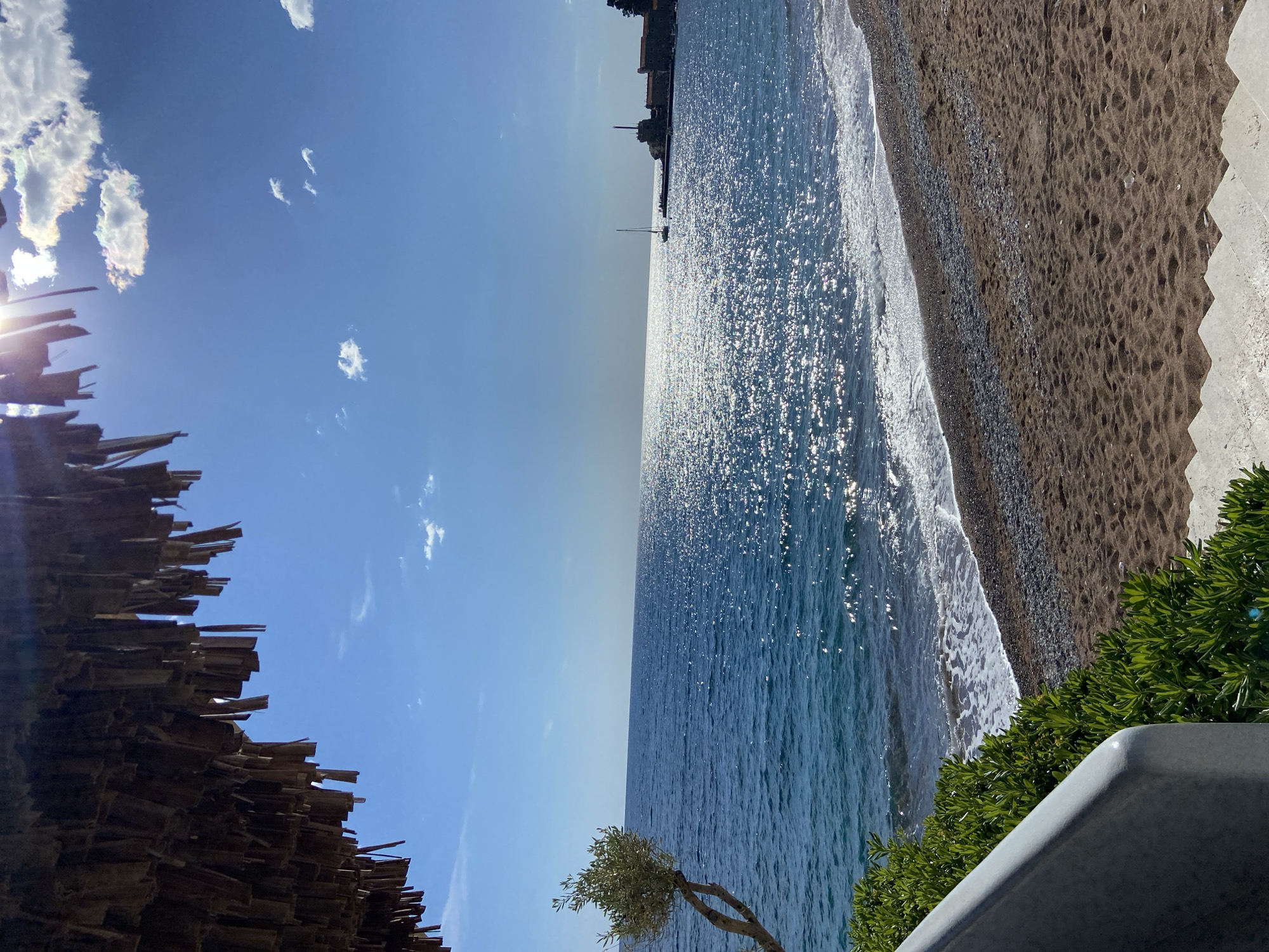 Tourist captures sunny Petrovac beach views and gelato shop visit