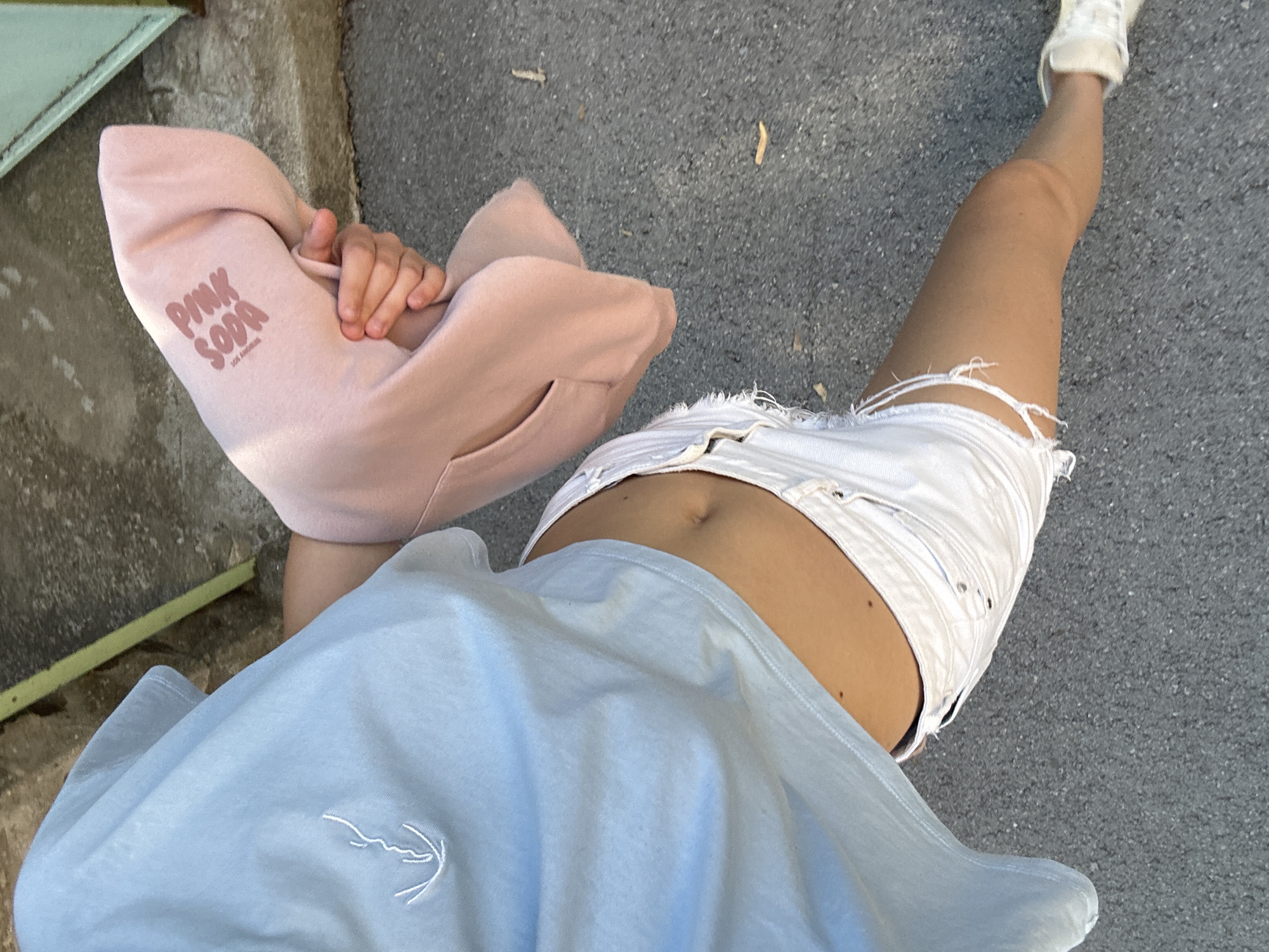 Casual street stop in Shumen, pink hoodie in hand
