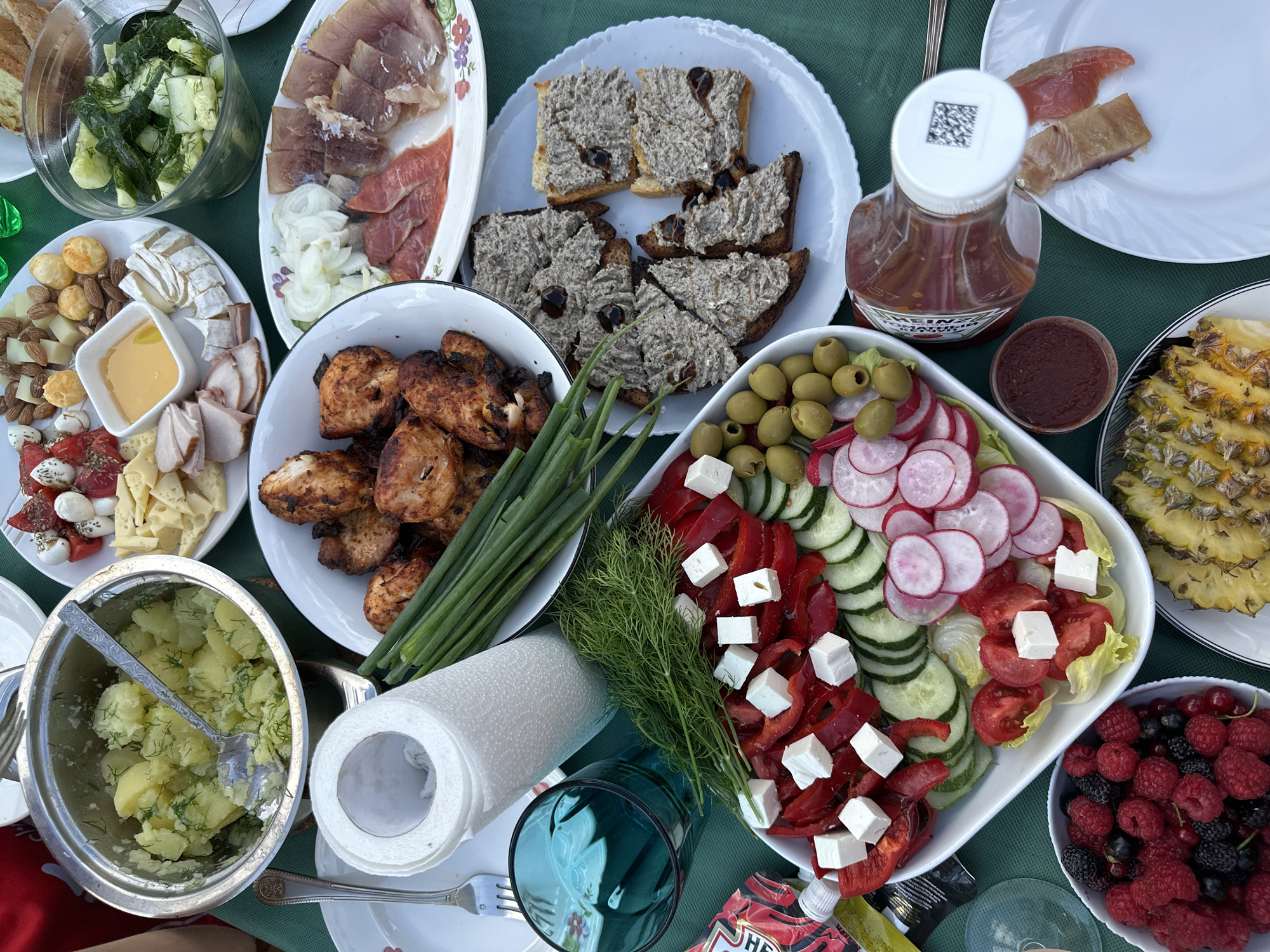 Outdoor gathering with a full spread in Chaikovsky, Russia