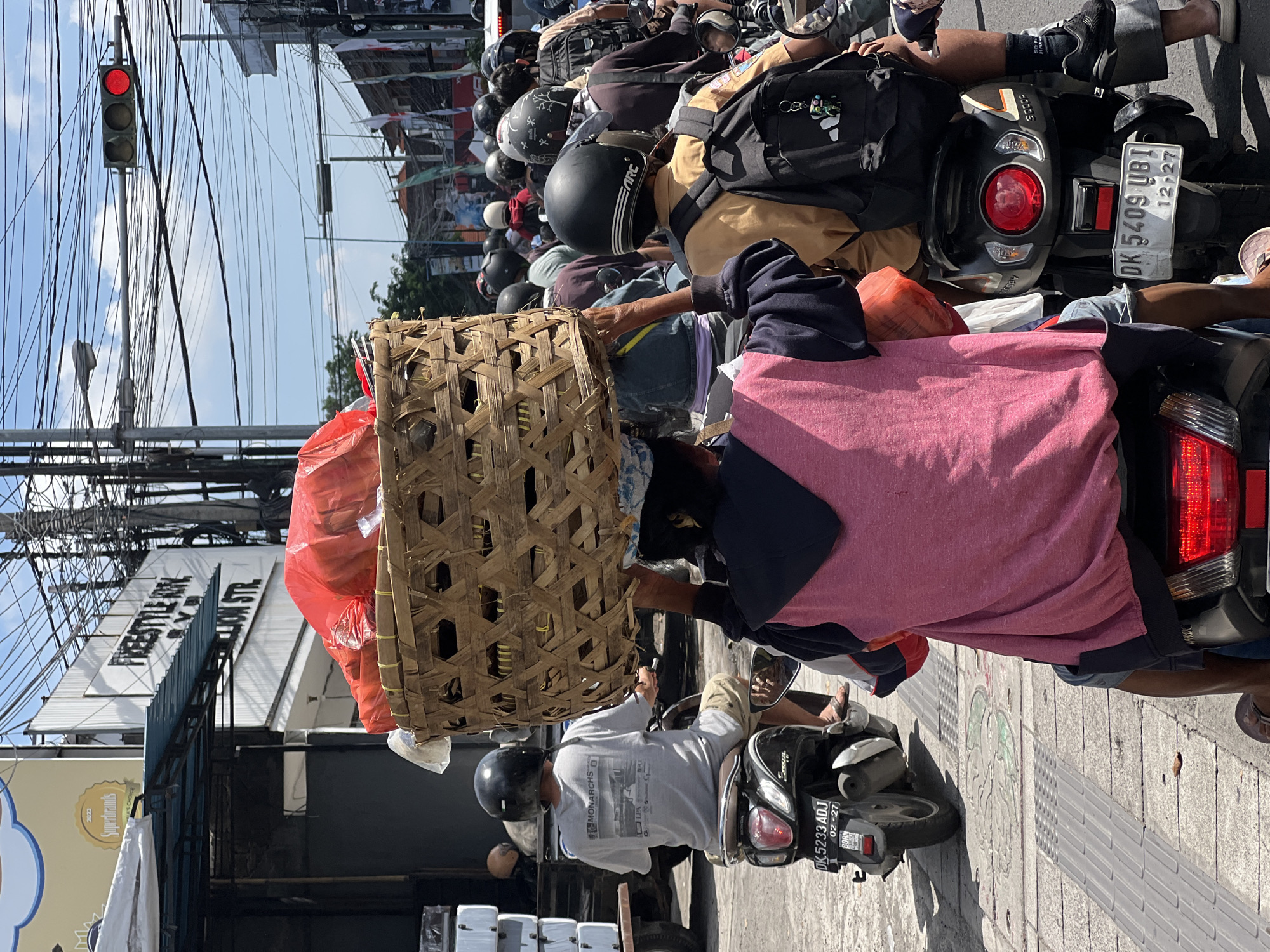 Heavy motorcycle traffic observed at Denpasar intersection