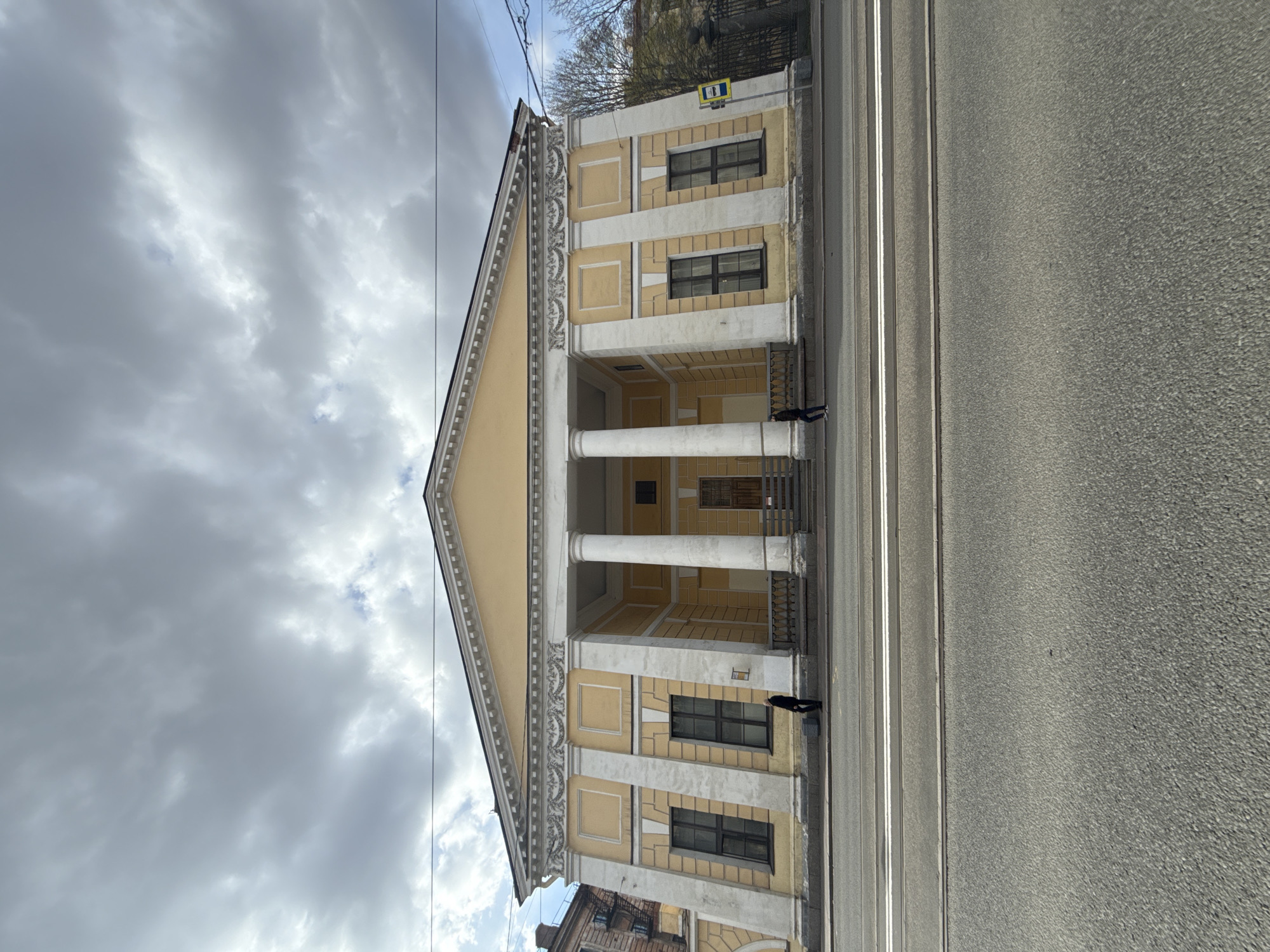 Classical yellow building with portico documented in Saint Petersburg