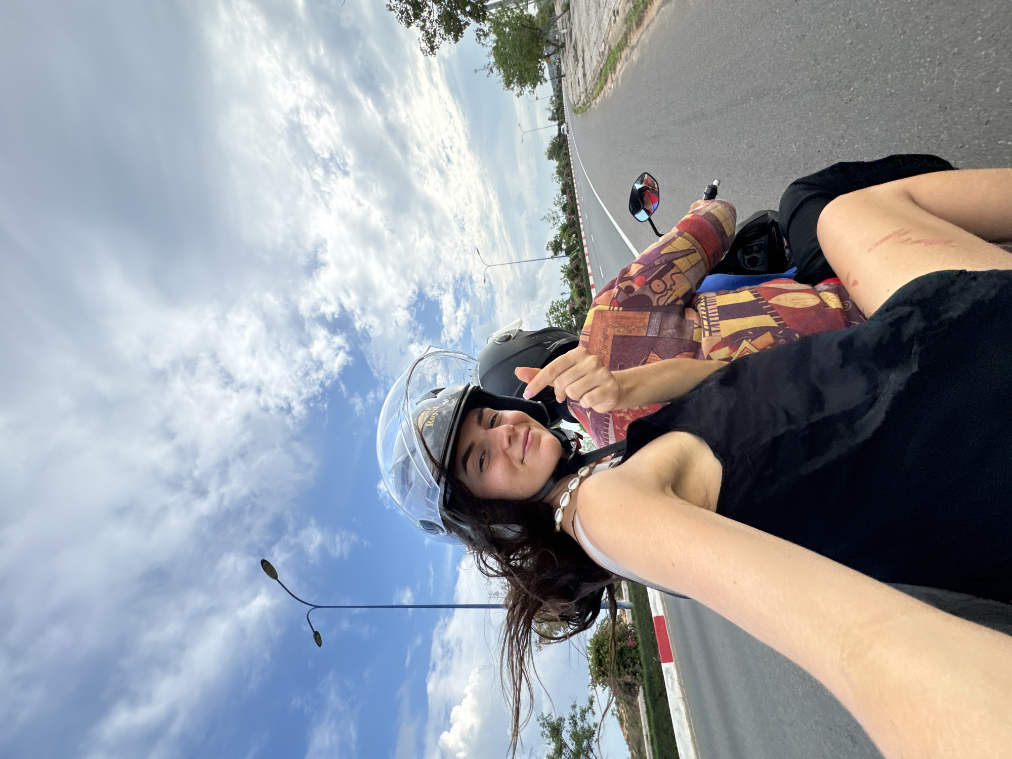 Scooter passengers capture selfie on Mui Ne road