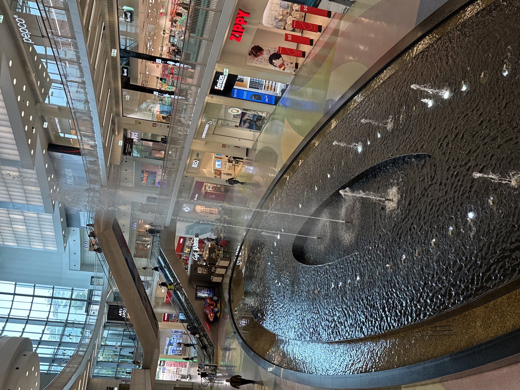 Everyday moments captured at Porto shopping mall fountain
