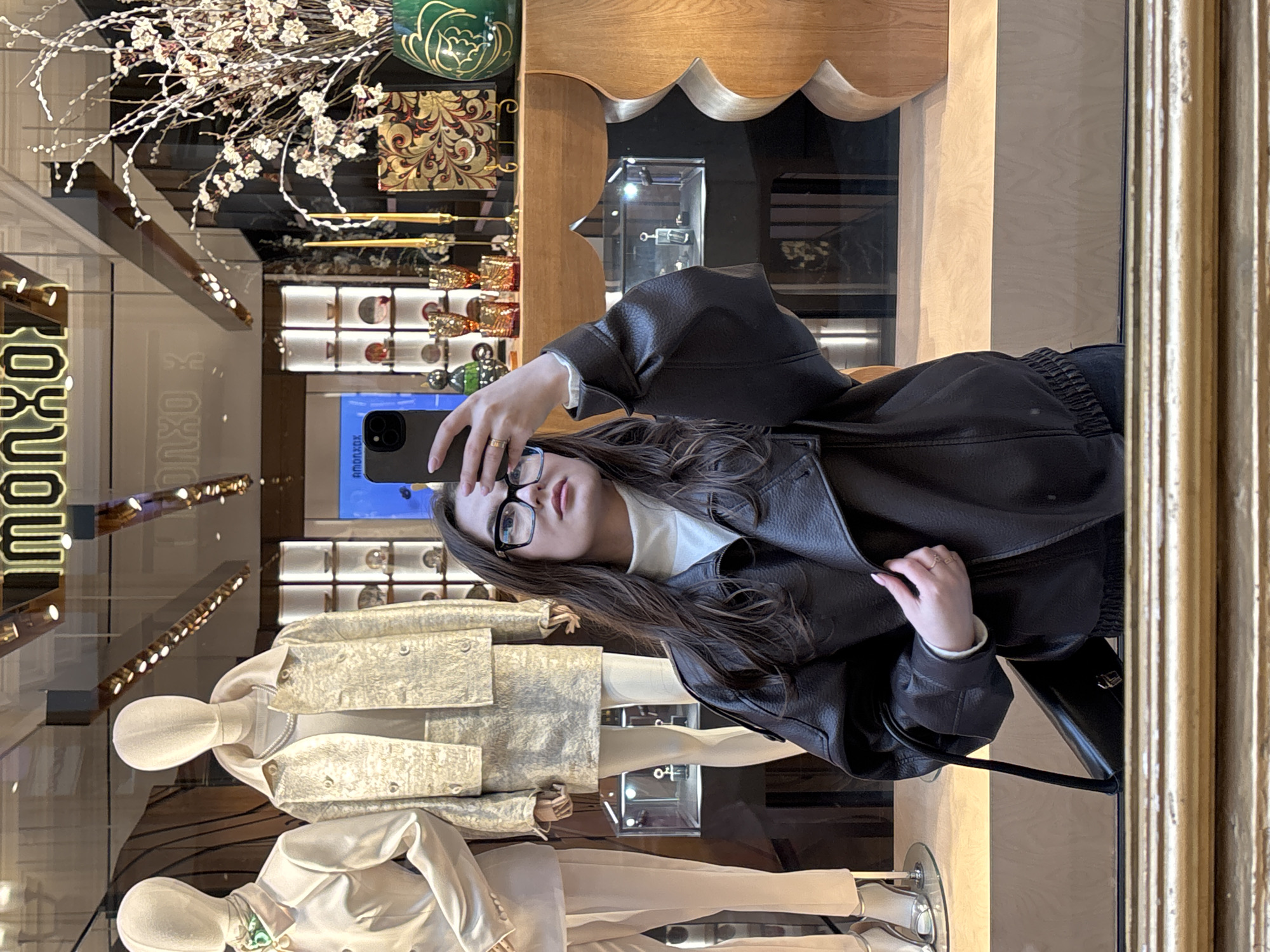 Woman takes selfies during shopping trip at Moscow's GUM