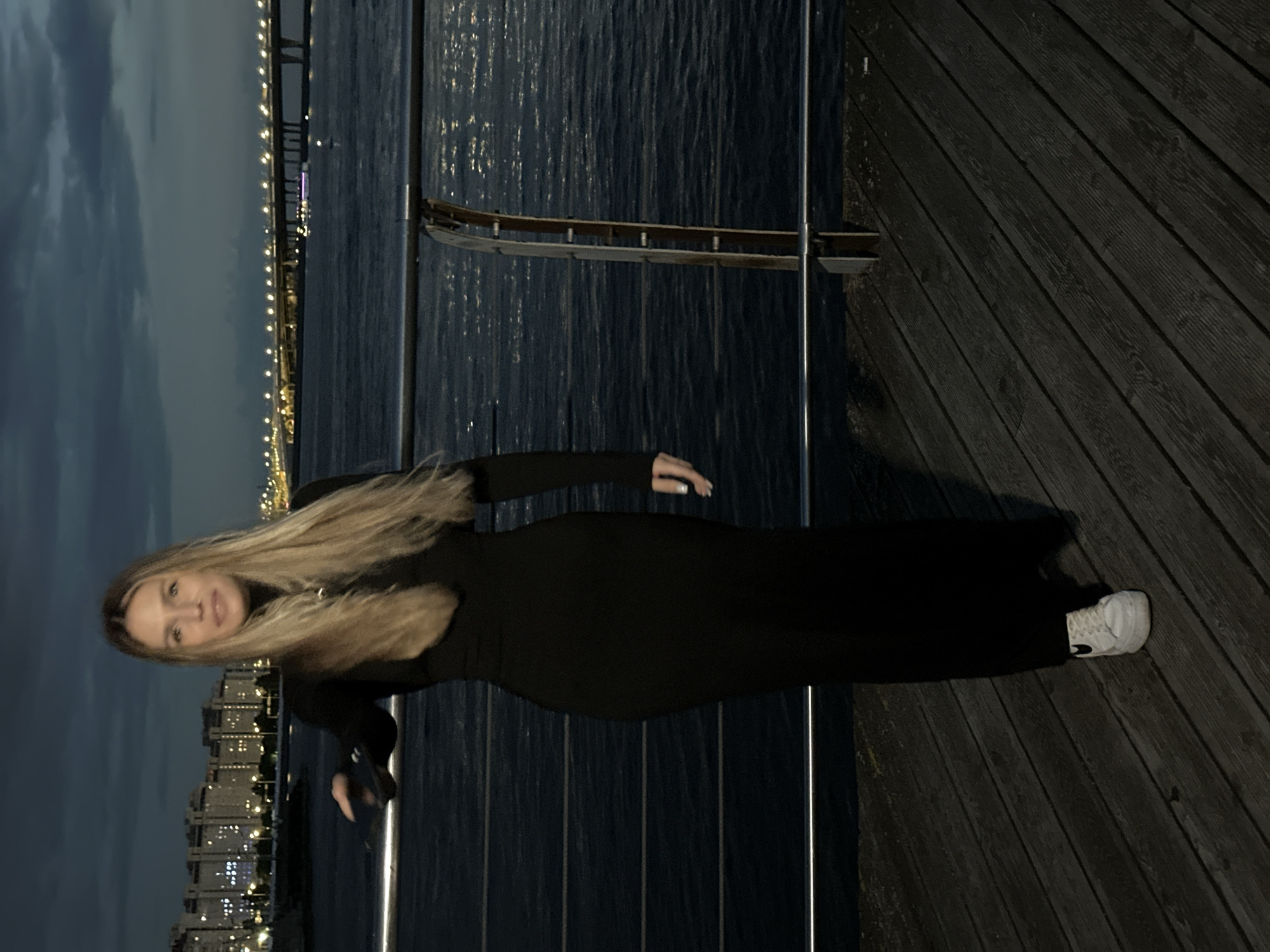 Nighttime pier photo session with Saint Petersburg skyline backdrop