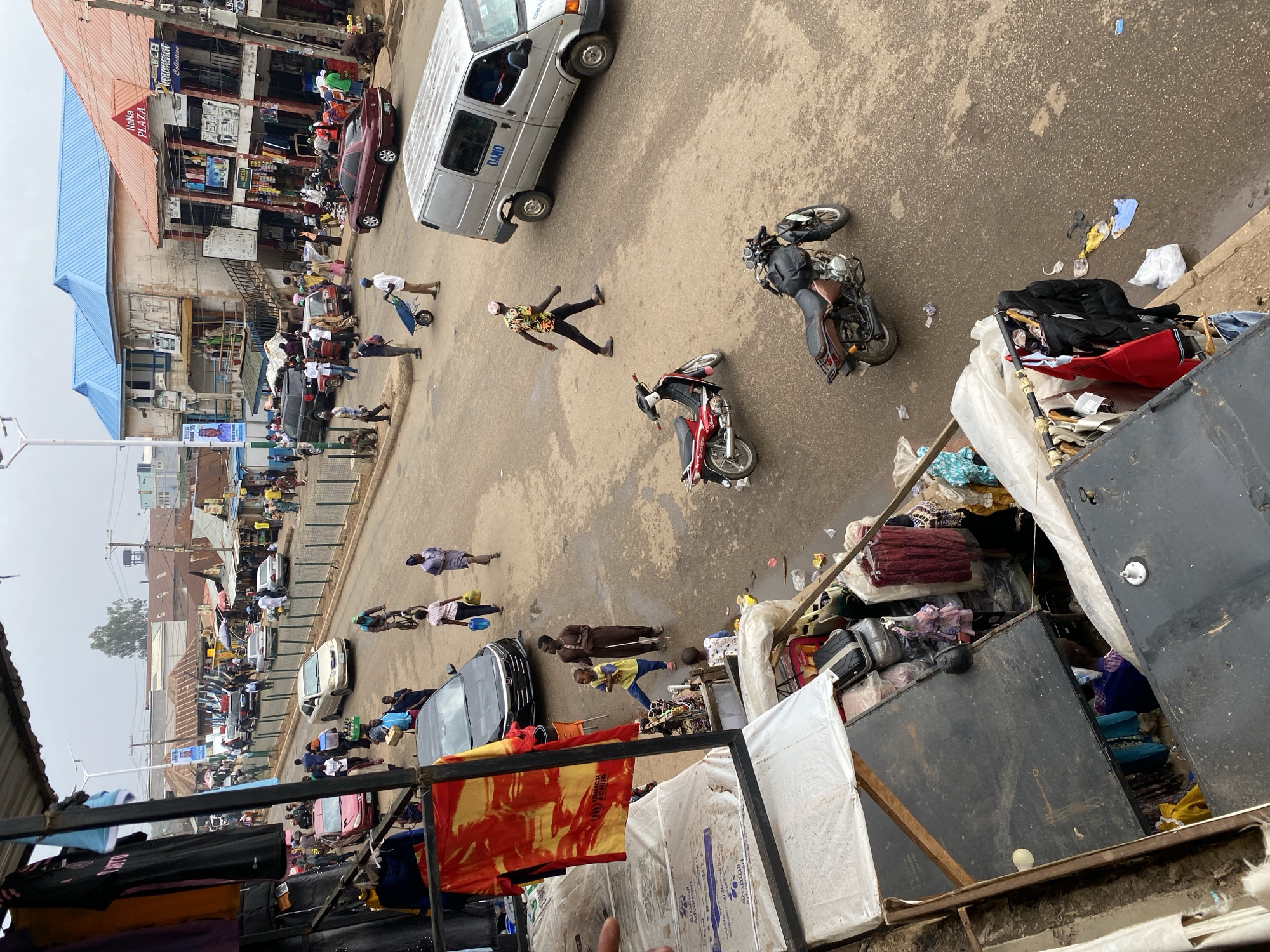 Street activity with police, vendors observed in Bukuru, Nigeria