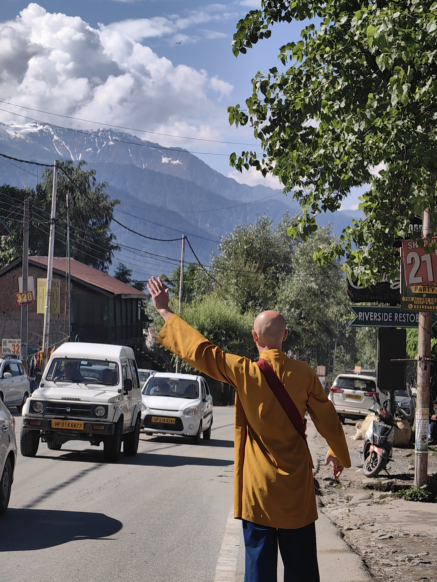 Mountain road trip through Kullu valley with monk encounter
