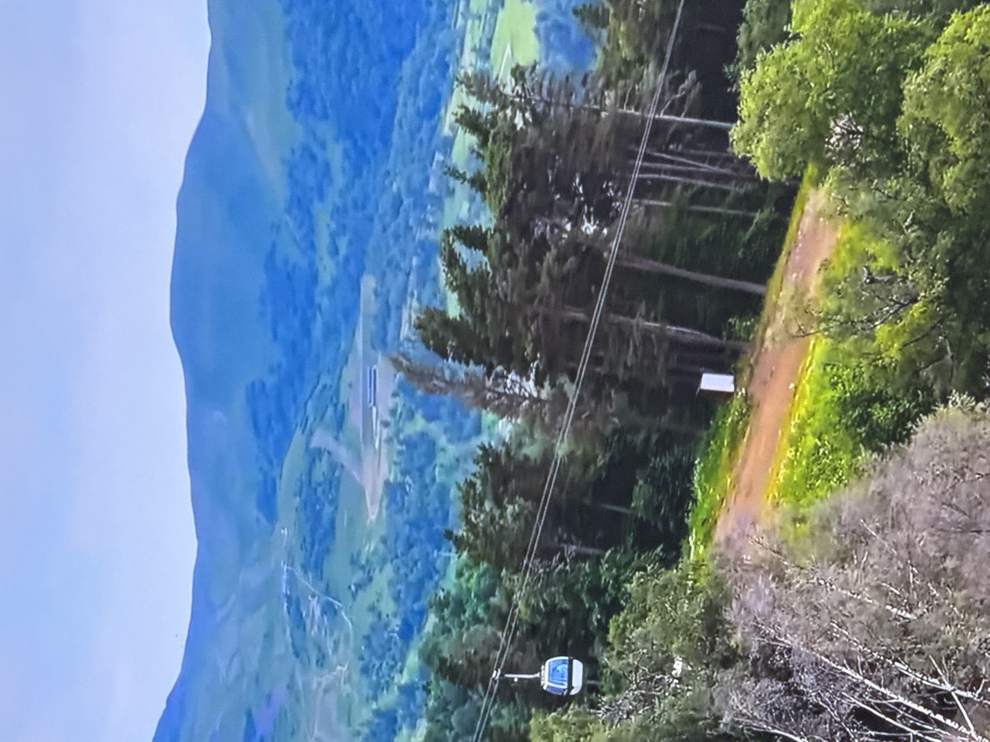 Cable car journey through mountain resort documented by traveler