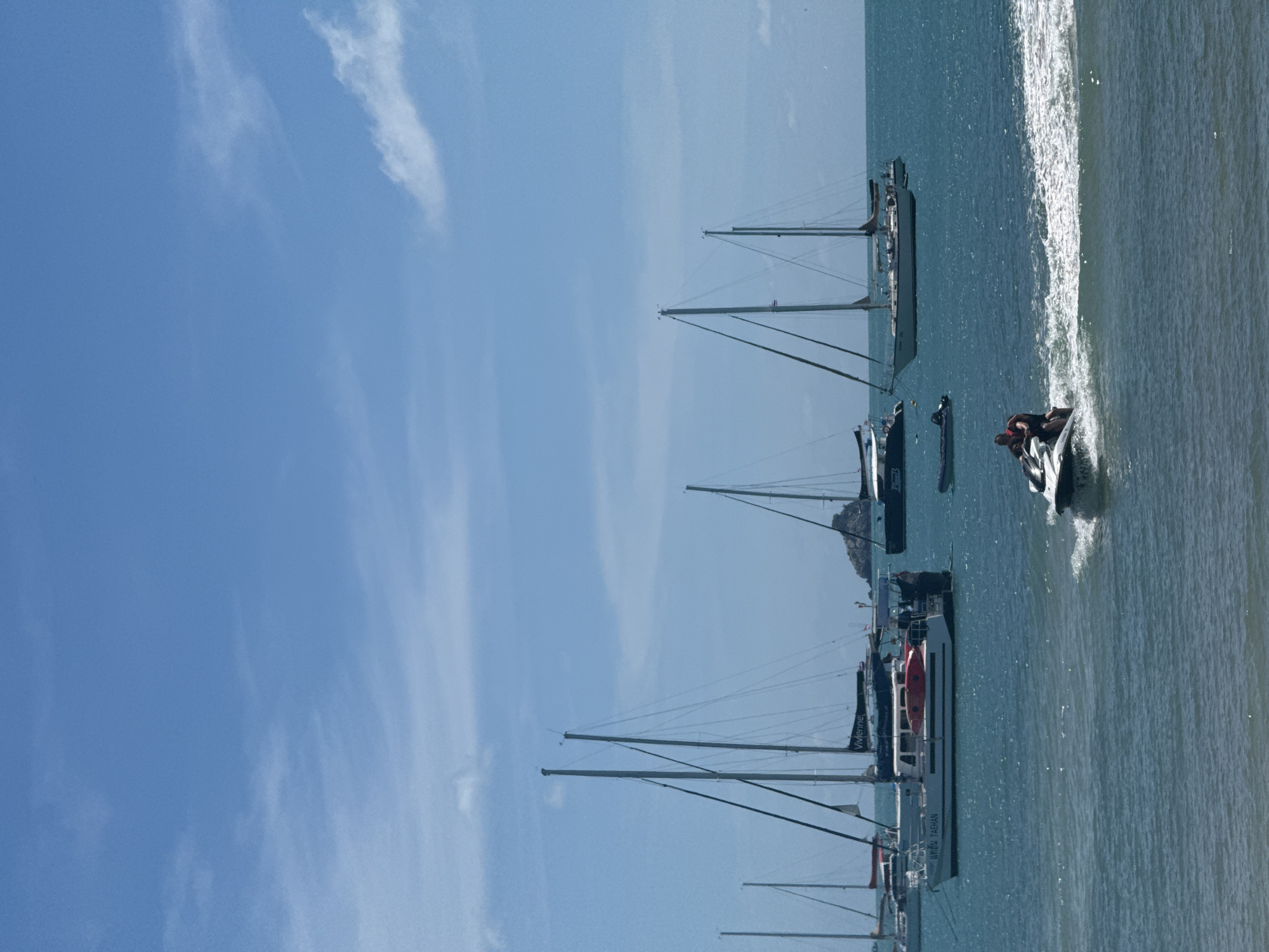 Jet skis and beach gear on a calm Choeng Mon morning