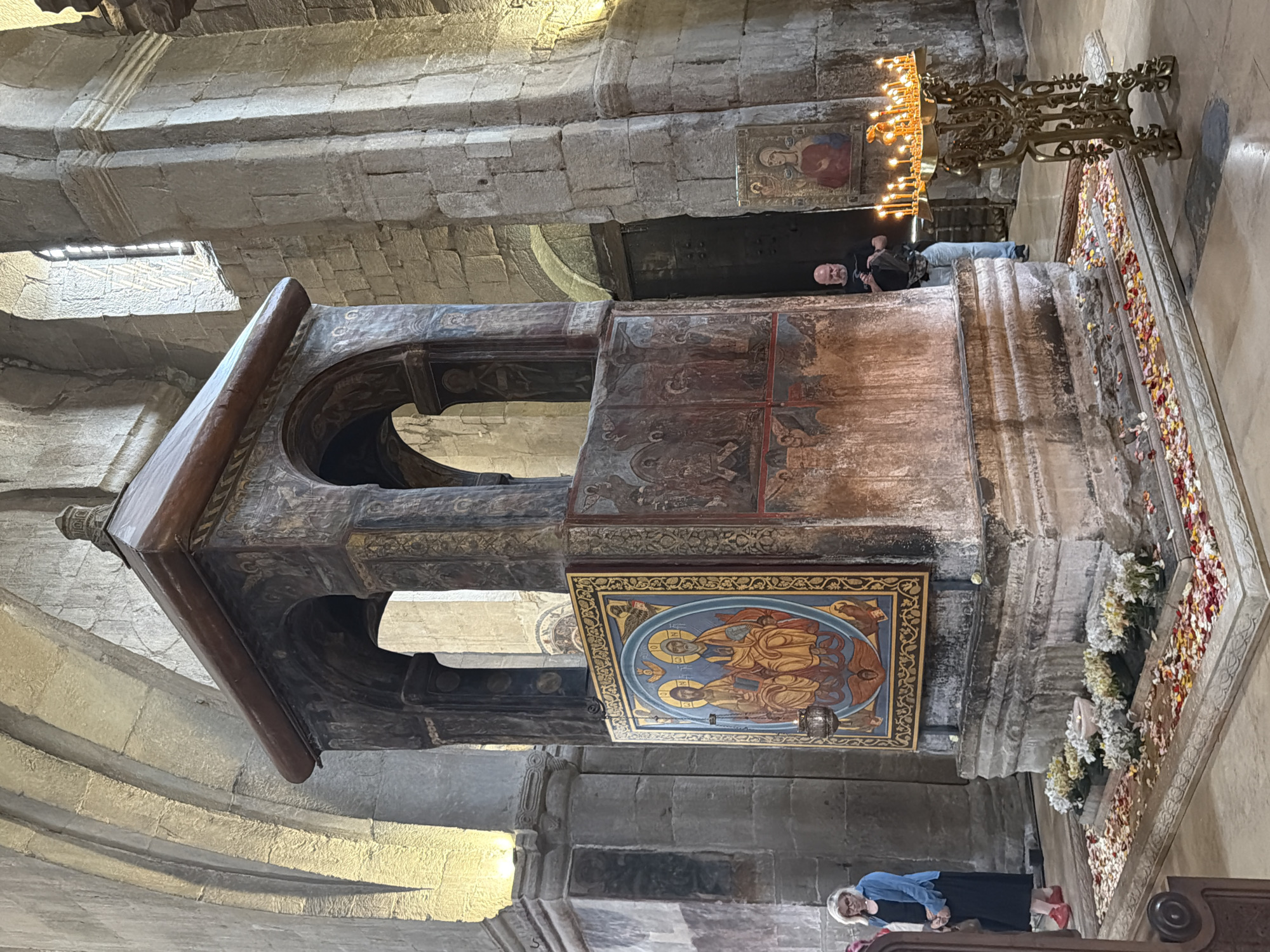 Visitor documents historic cathedral interiors in Mtskheta, Georgia