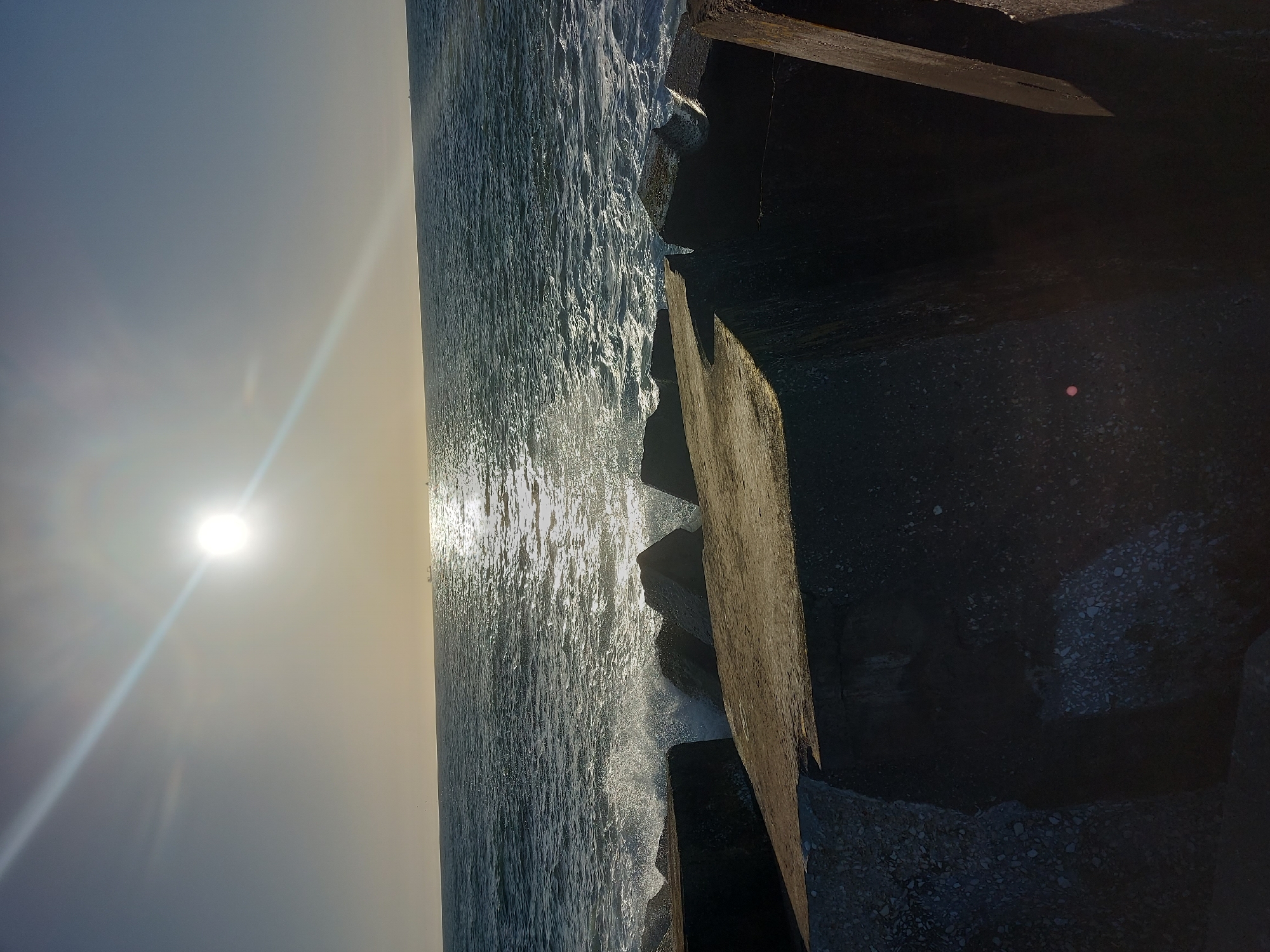 Evening coastal activity documented at Figueira da Foz breakwater