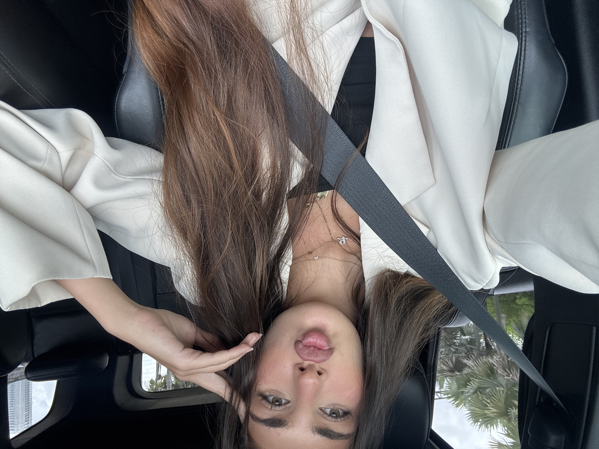 Woman in white blazer observed in car in Miami