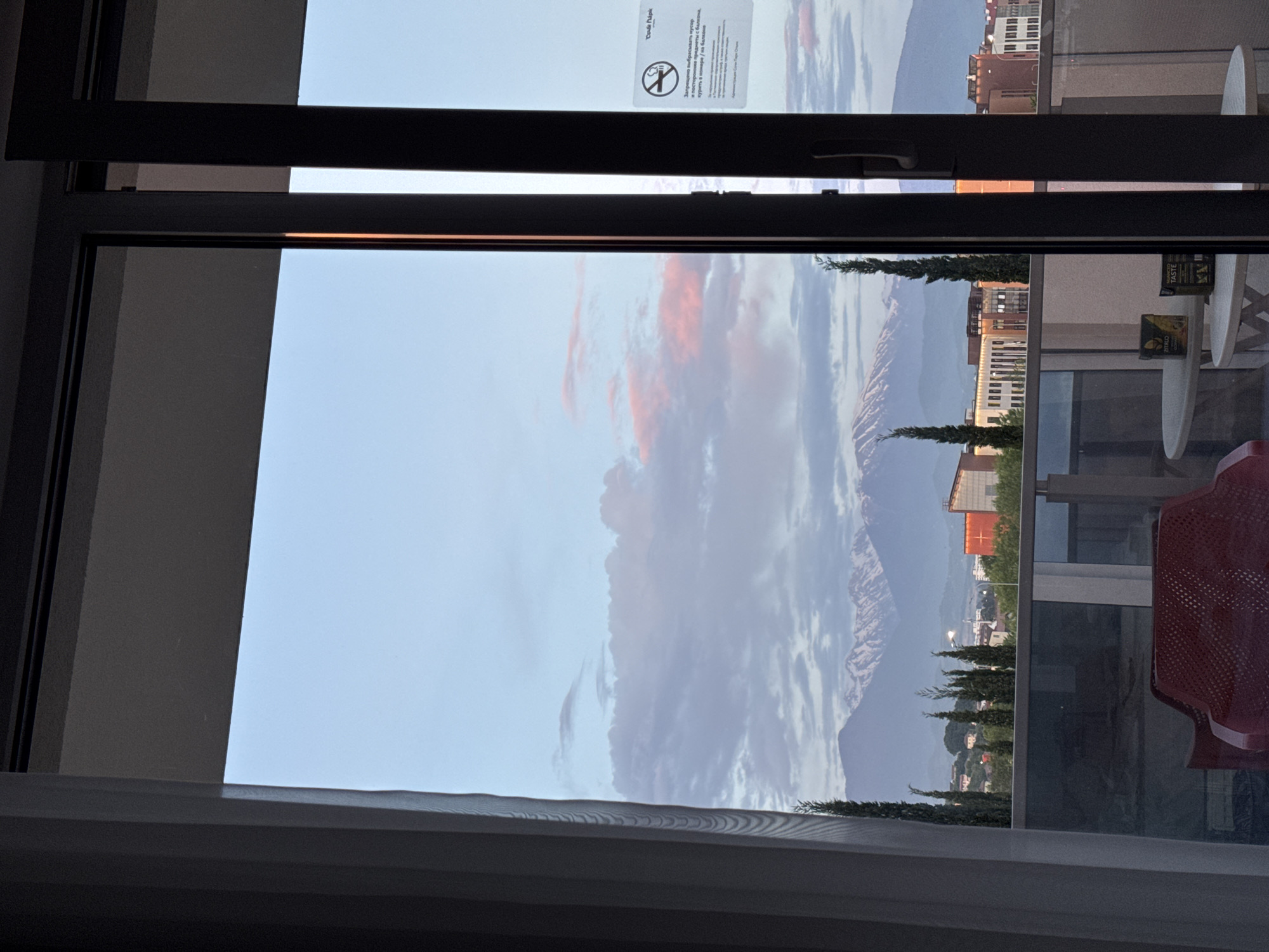 Sunset observed over Sochi mountains and cityscape