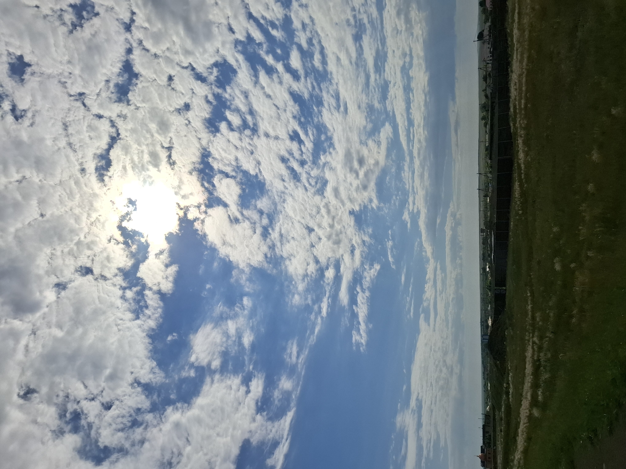 Morning sunlight breaks through clouds over Kazakhstan grasslands