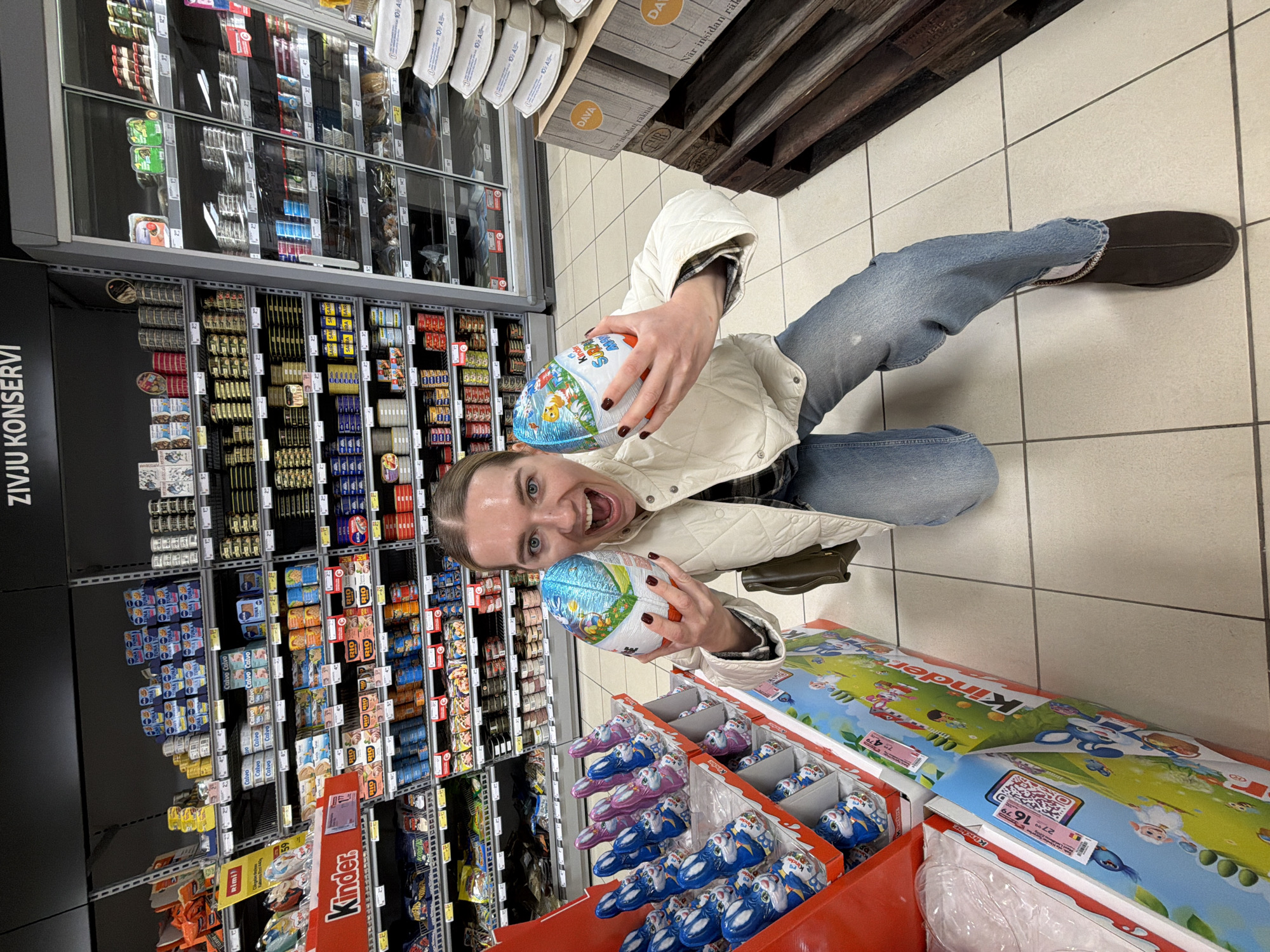 Woman enjoys grocery shopping trip in Riga supermarket