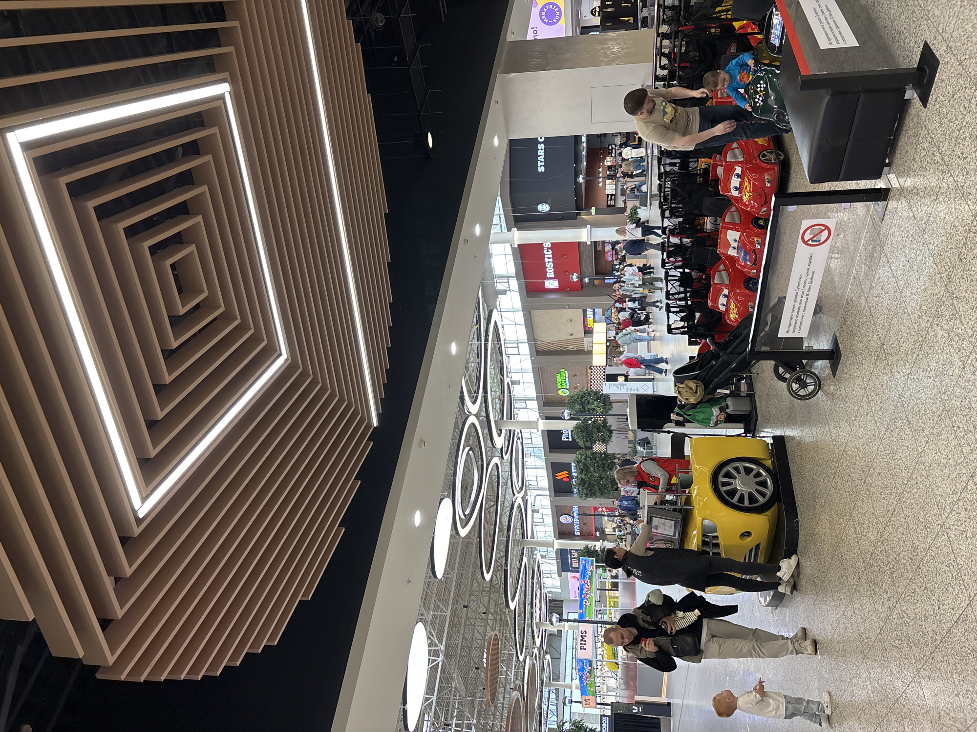 Casual afternoon moments captured at Kudrovo shopping mall