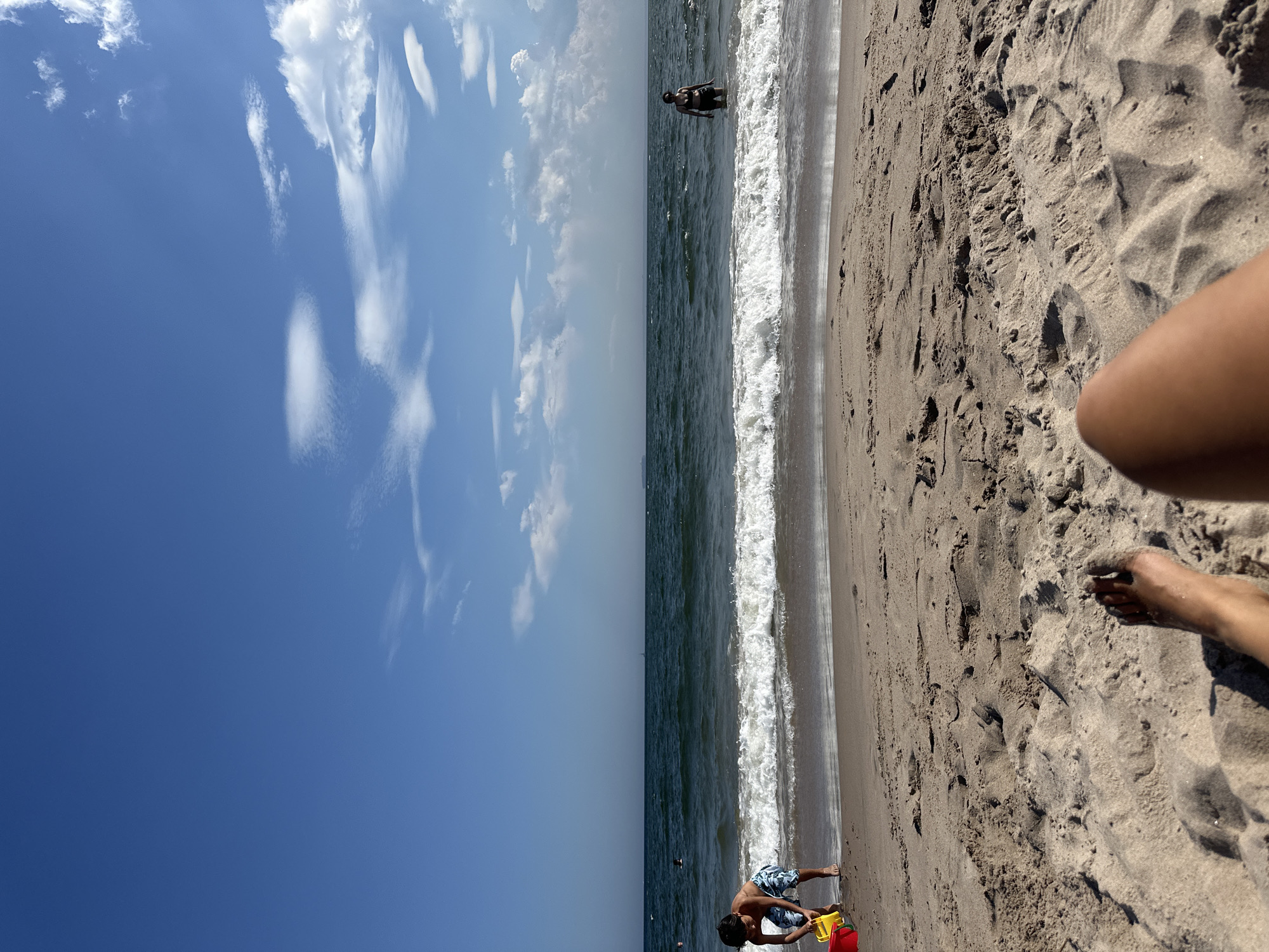 Lazy afternoon on a New York beach, stretched out in the sand.