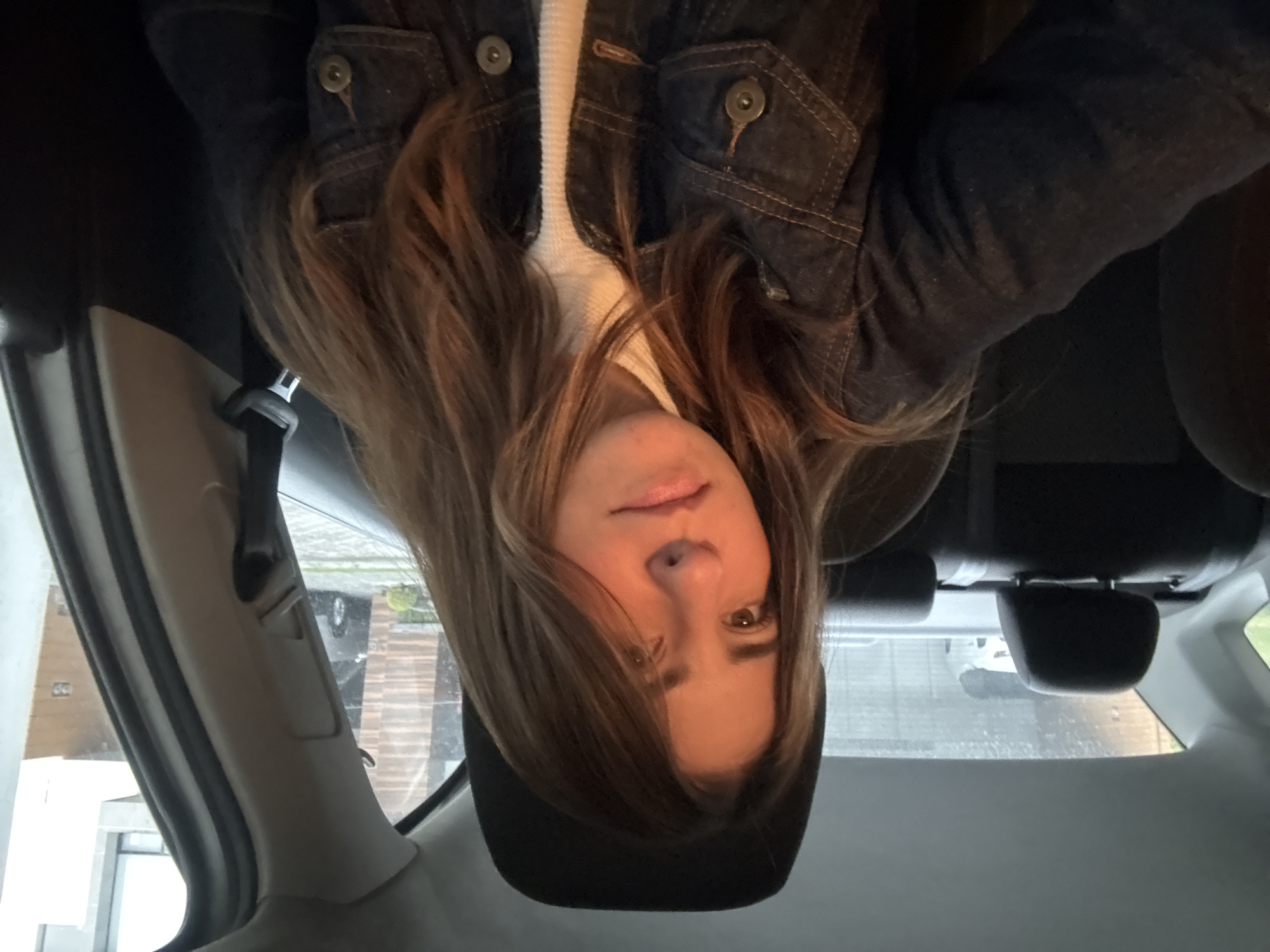 Woman photographed in car backseat during late night Puebla journey