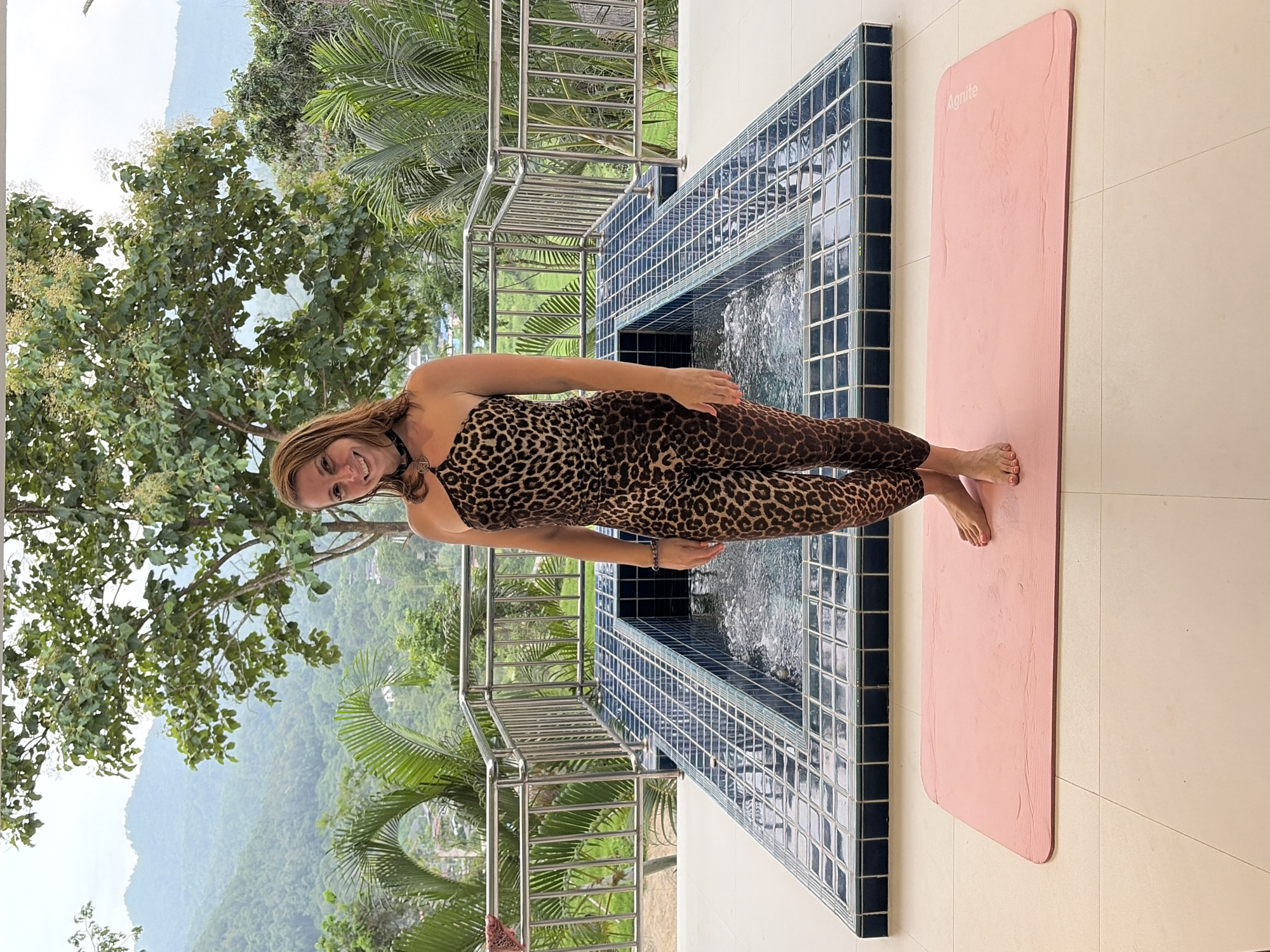 Outdoor yoga session on a tiled patio in Ban Kao Dua