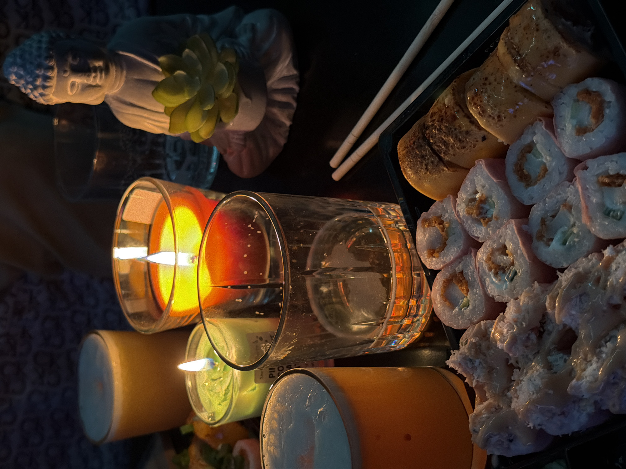 Cocktail preparation accompanies sushi dinner in candlelit Varna setting