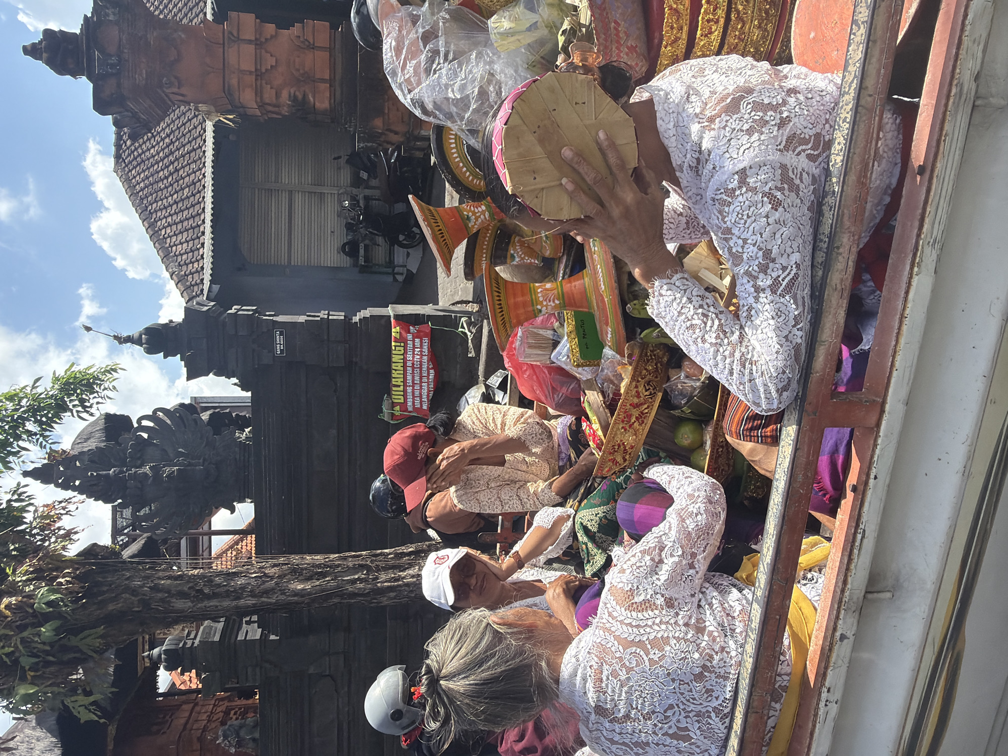 Traditional Balinese ceremonial procession moving through North Kuta