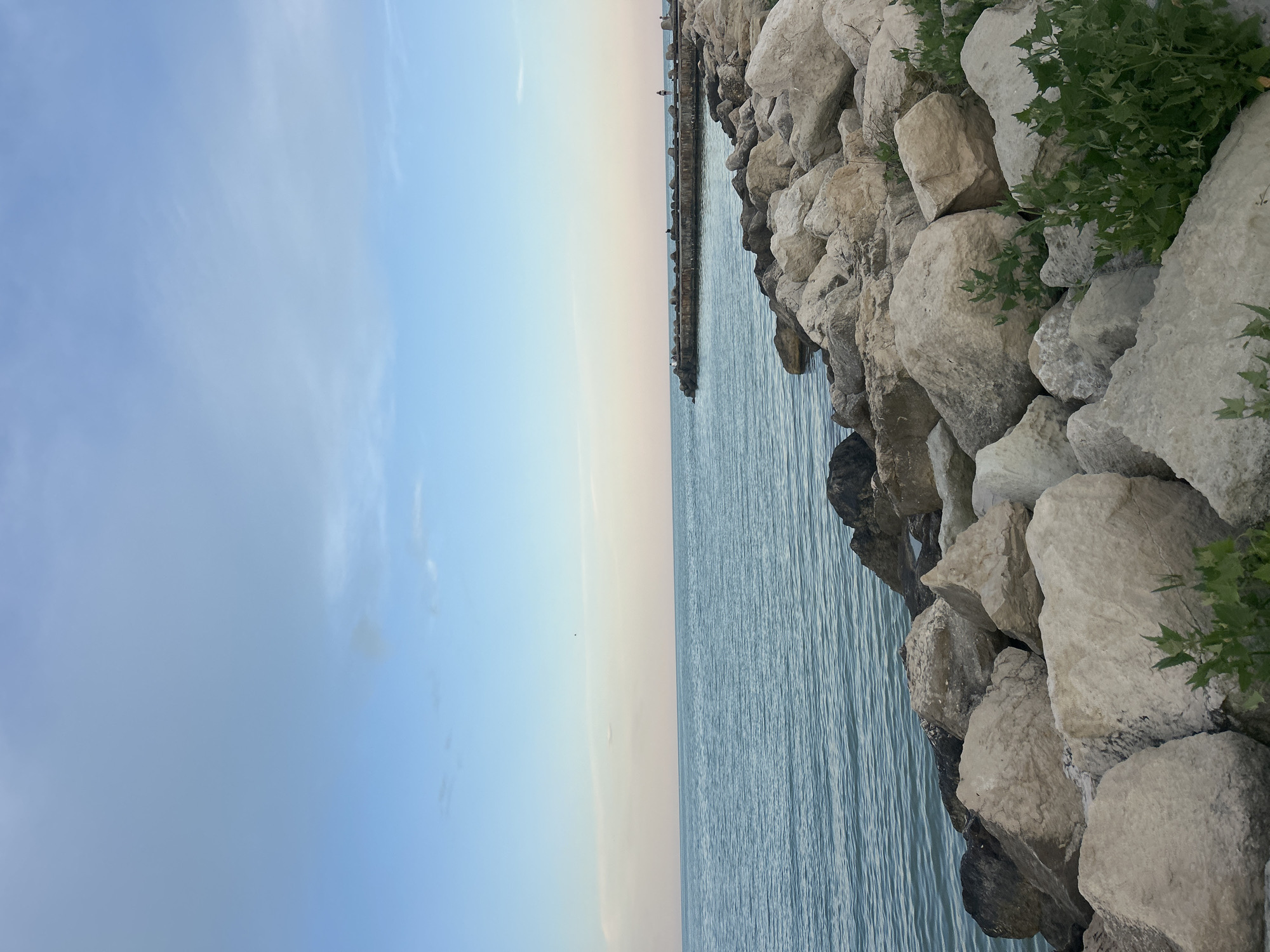 Twilight scenes captured across coastal and rural landscapes during sunset