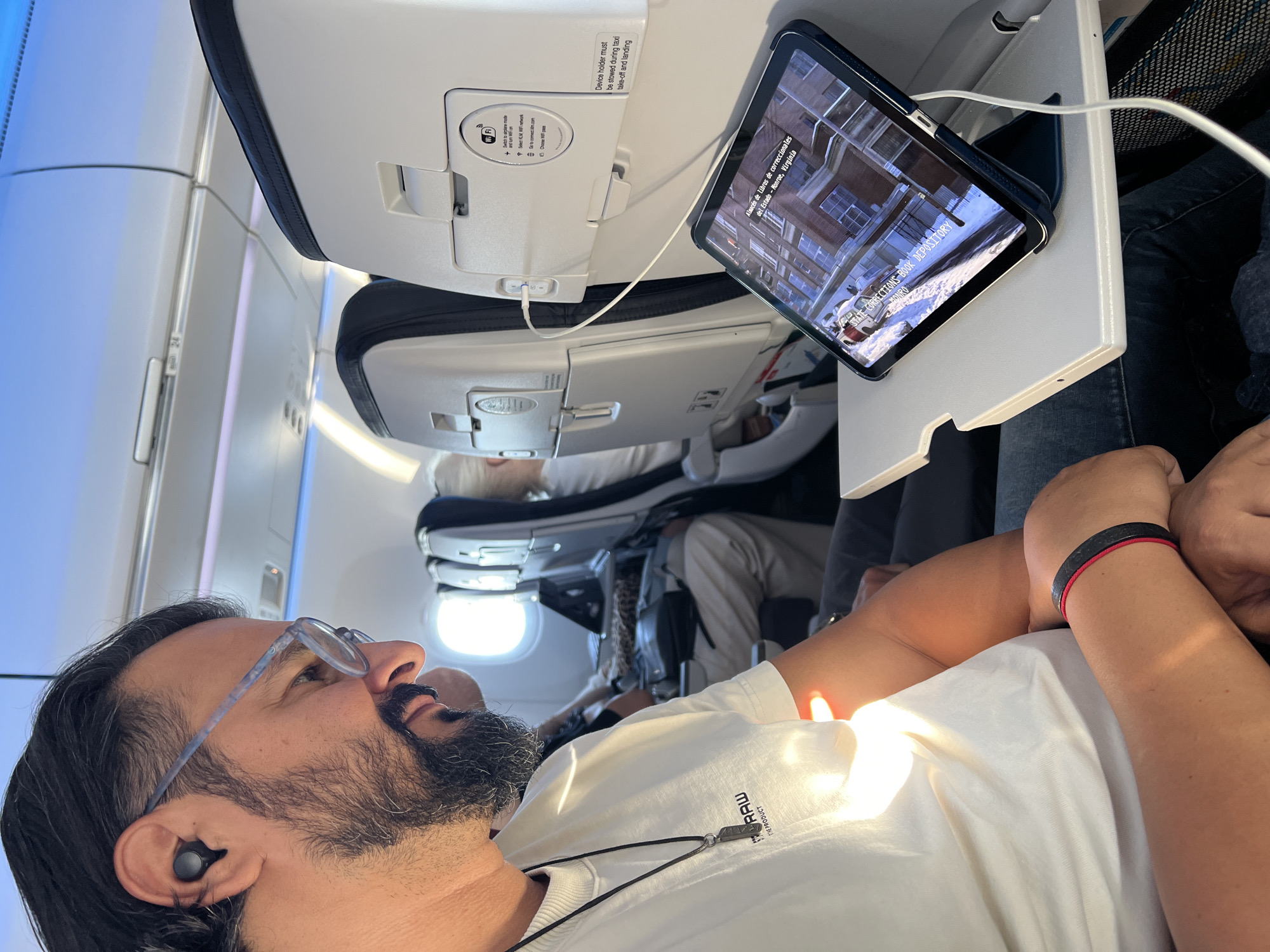 Aboard a KLM flight, cruising above the clouds near Amsterdam