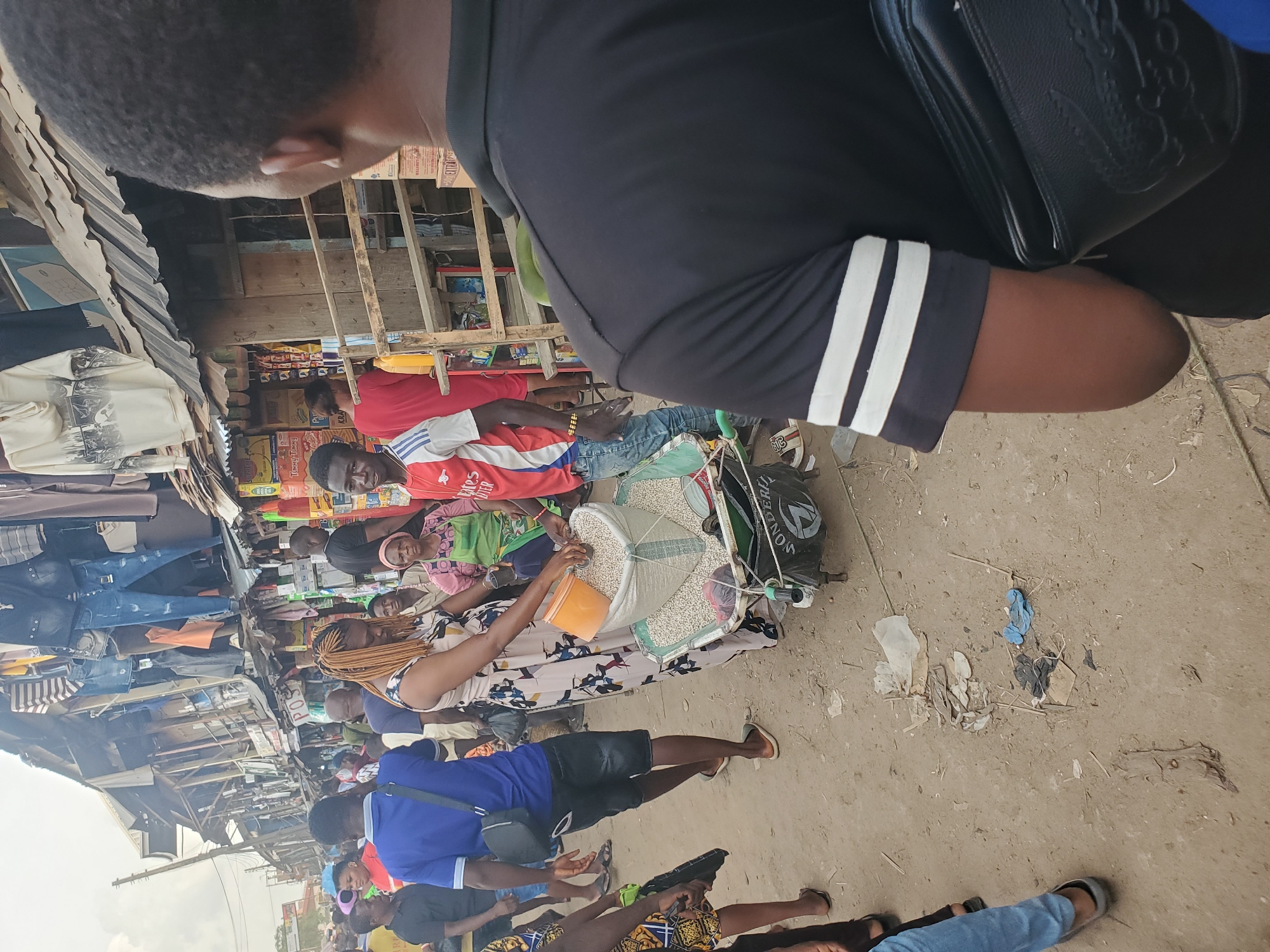 Street vendor sells grains from cart in Fegge, Nigeria